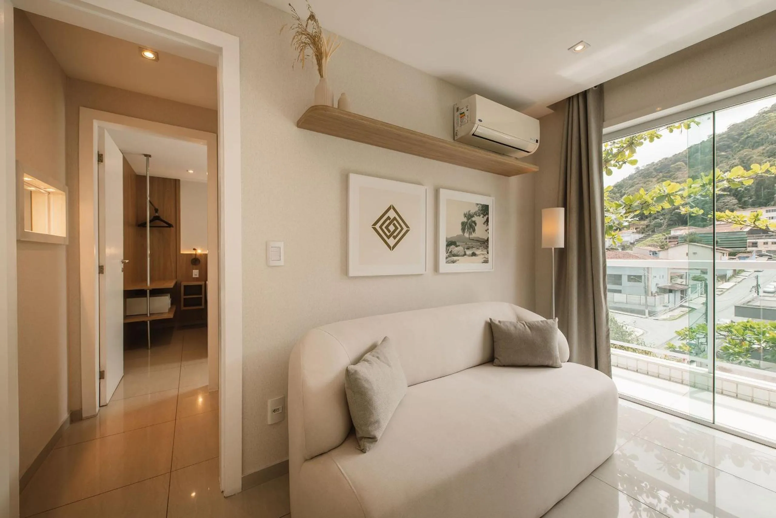 Seating area, Bed in Angra Beach Hotel