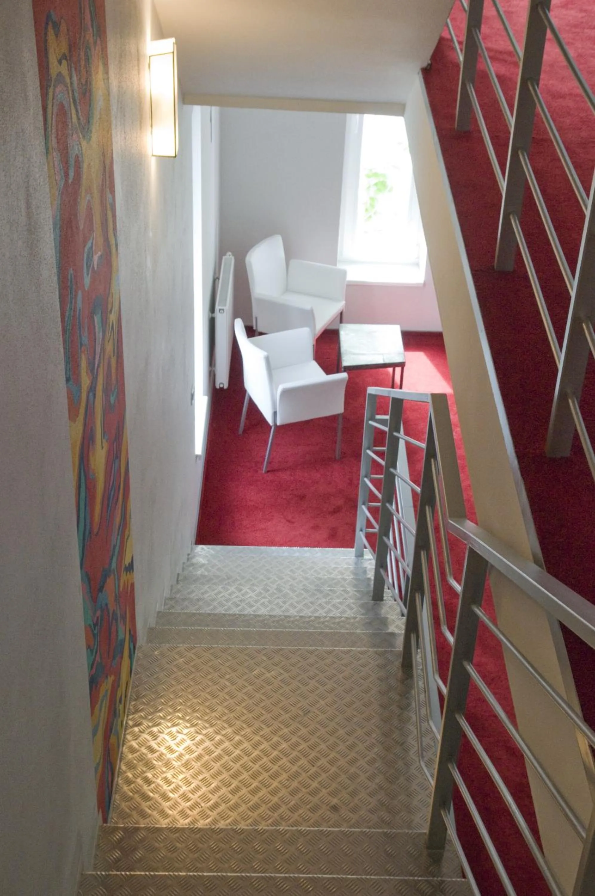 Seating area, Bed in Hotel Olympia