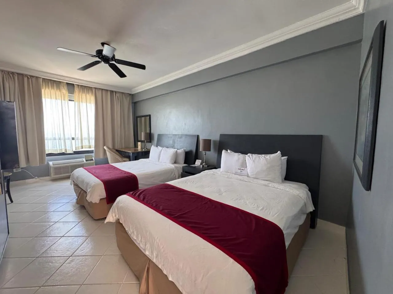 Bed in Ramada by Wyndham Princess Belize City