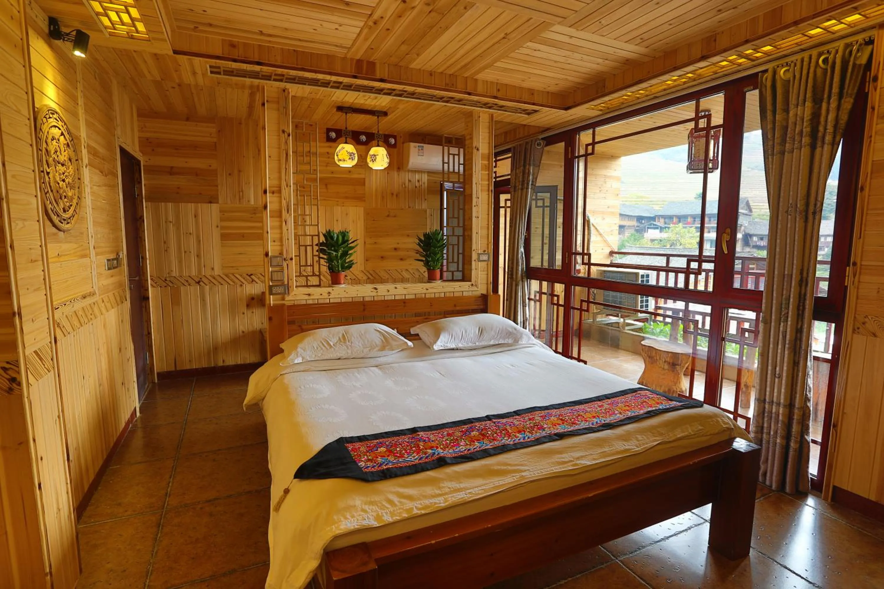 Bed in Longji Holiday Hotel