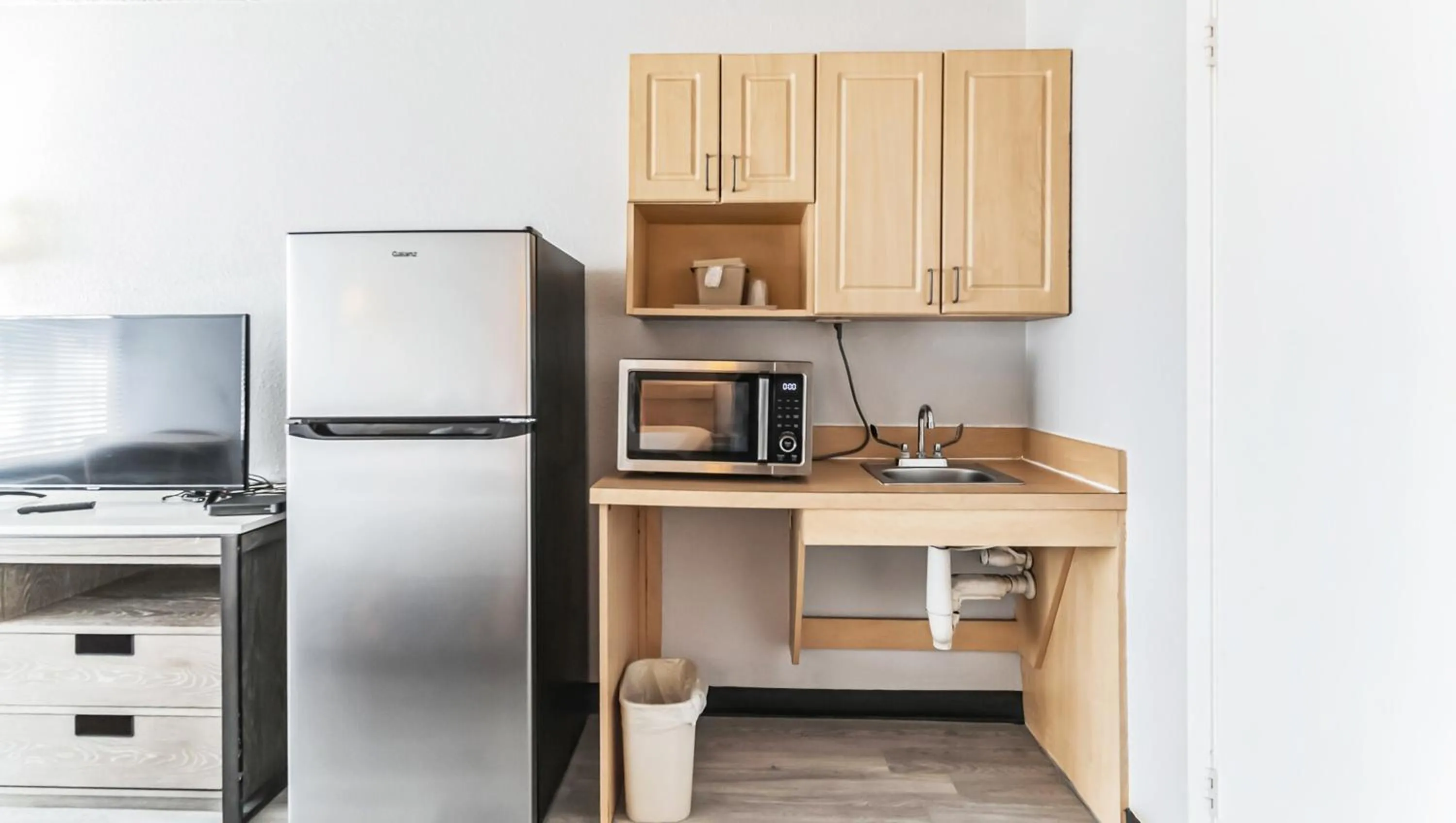 Kitchen or kitchenette in Home 1 Suites Extended Stay - Kissimmee