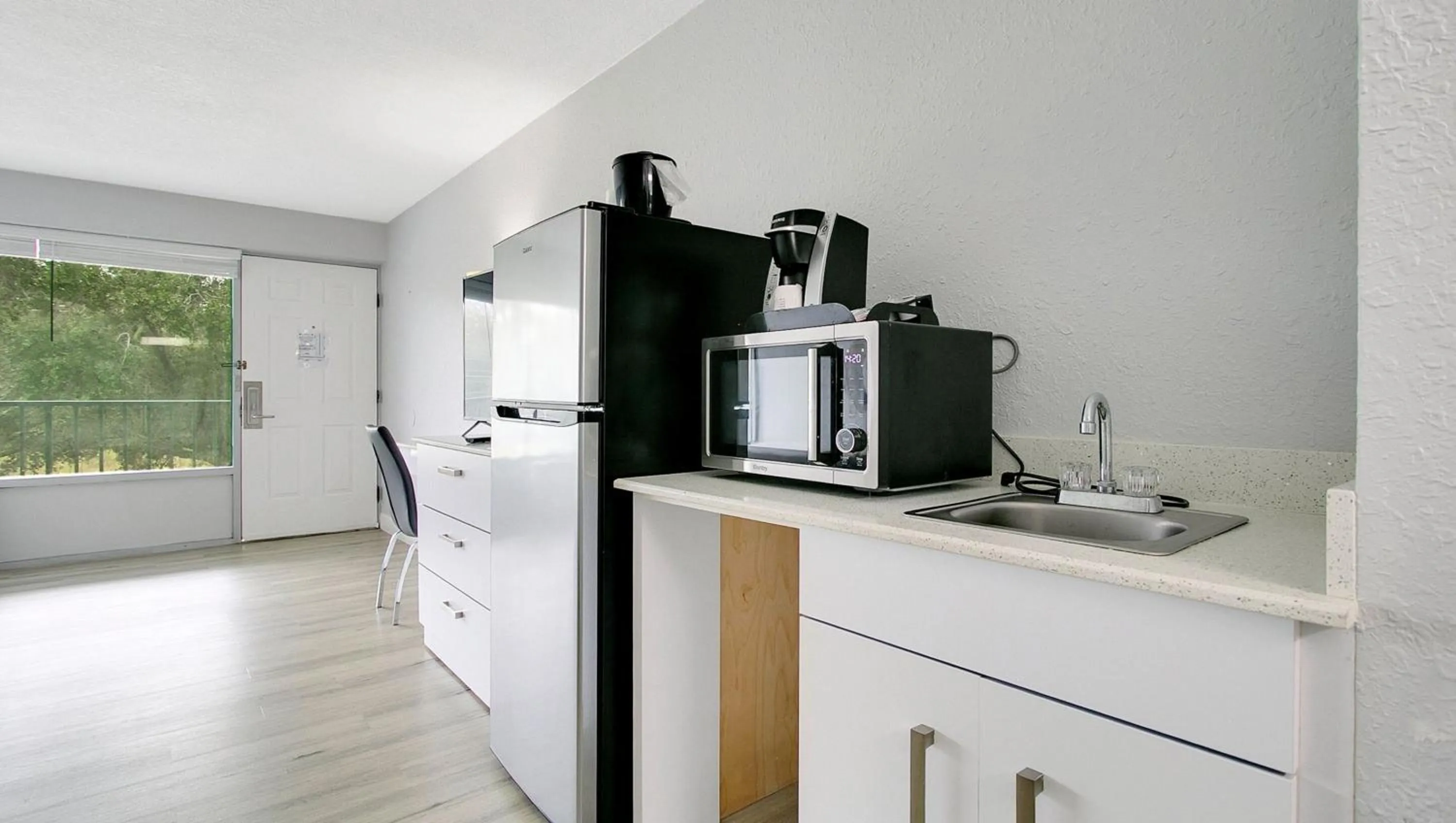 Kitchen or kitchenette in Home 1 Suites Extended Stay - Kissimmee