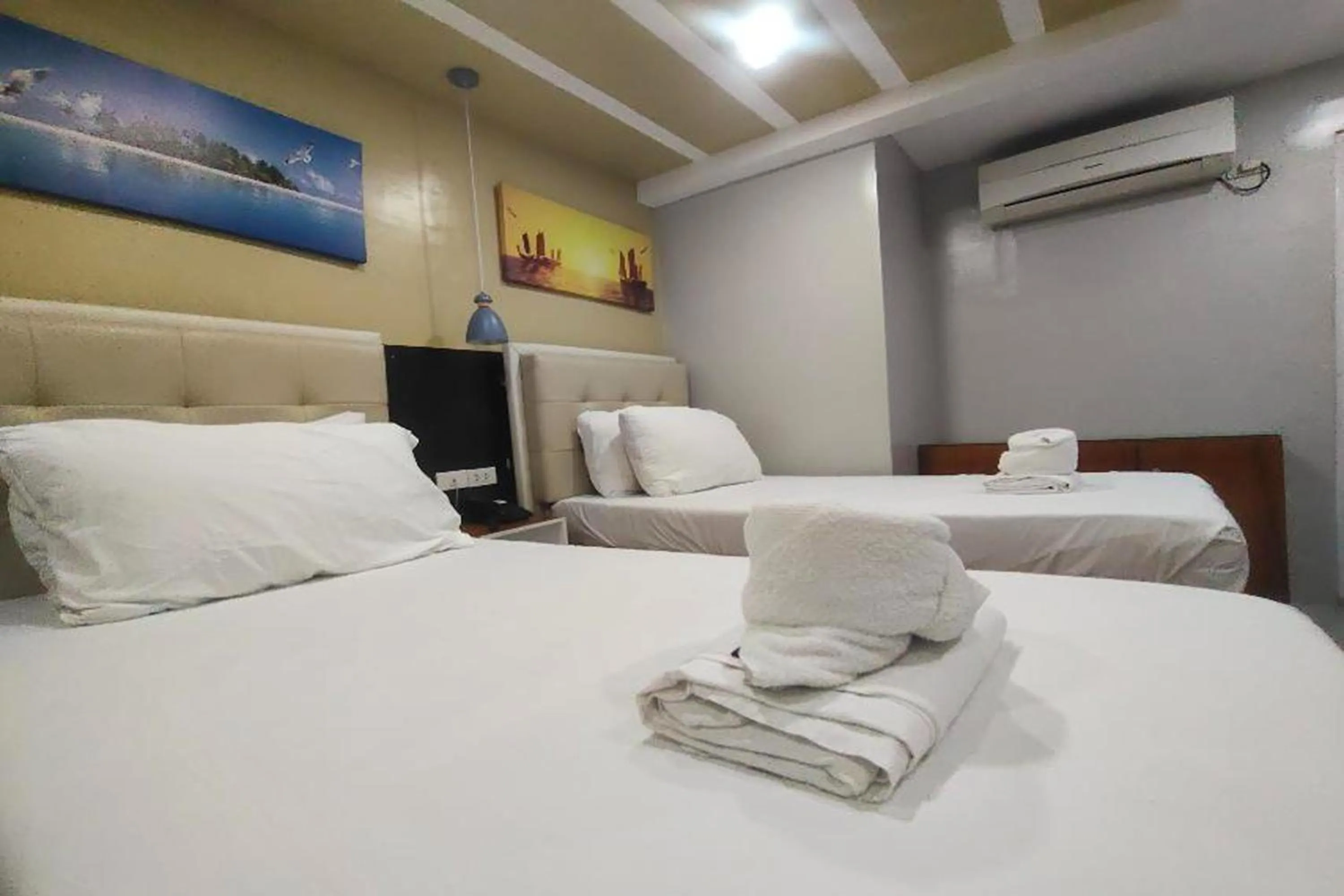 Photo of the whole room, Bed in Taj Hotel Tuguegarao