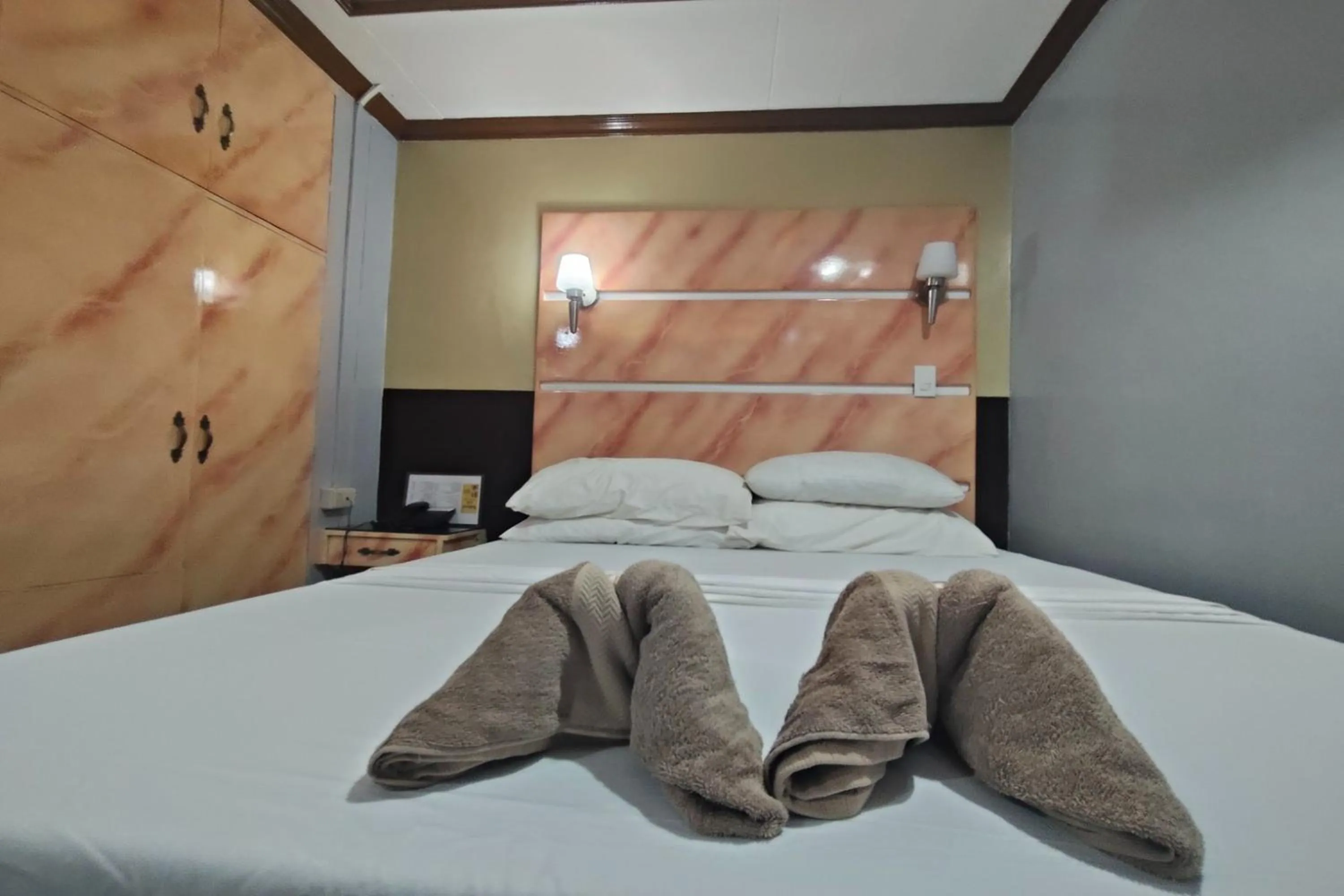 Photo of the whole room, Bed in Taj Hotel Tuguegarao