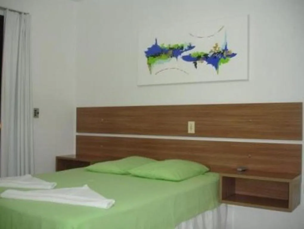 Bed in Pousada Guaruja