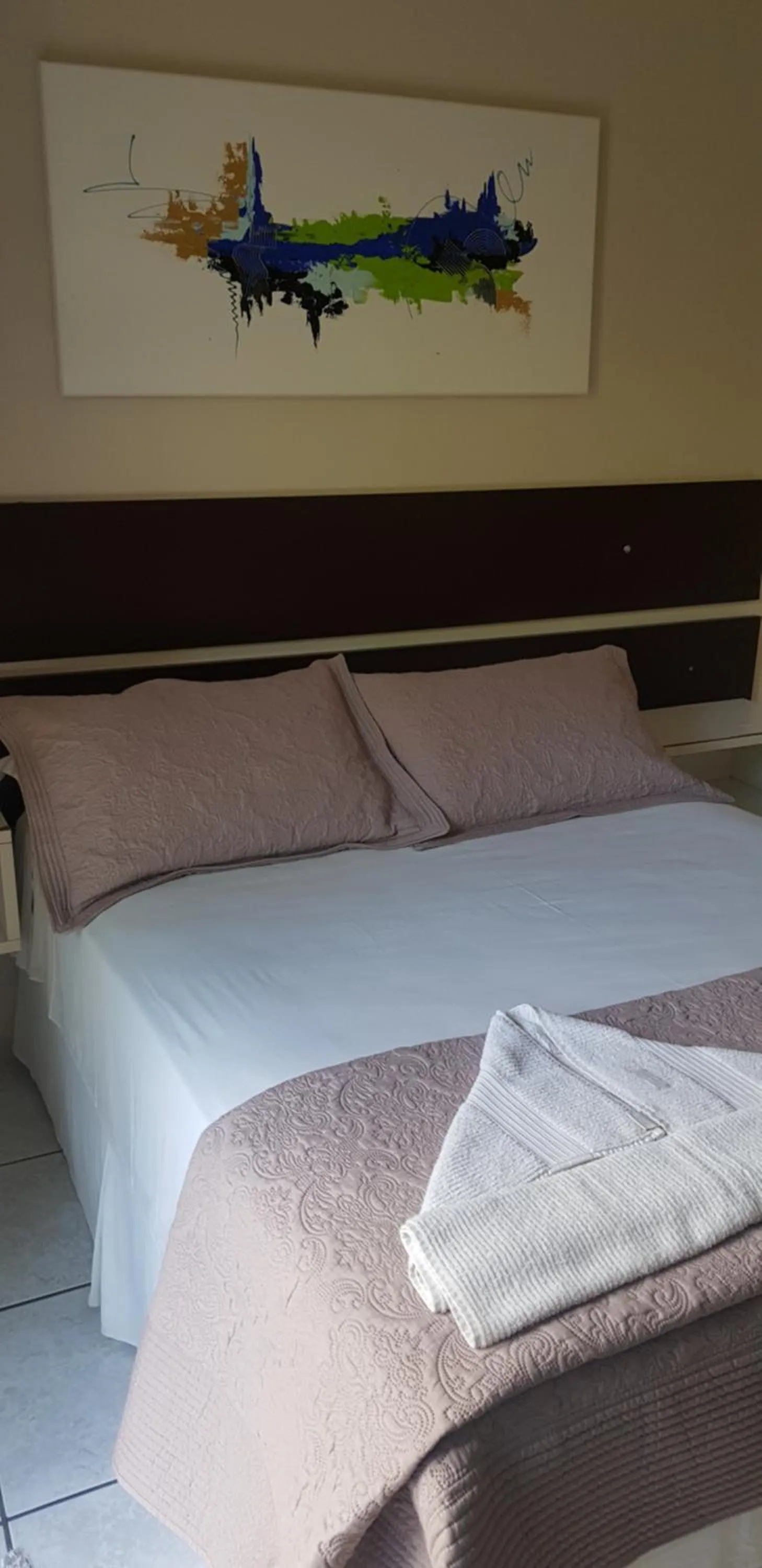 Bed in Pousada Guaruja