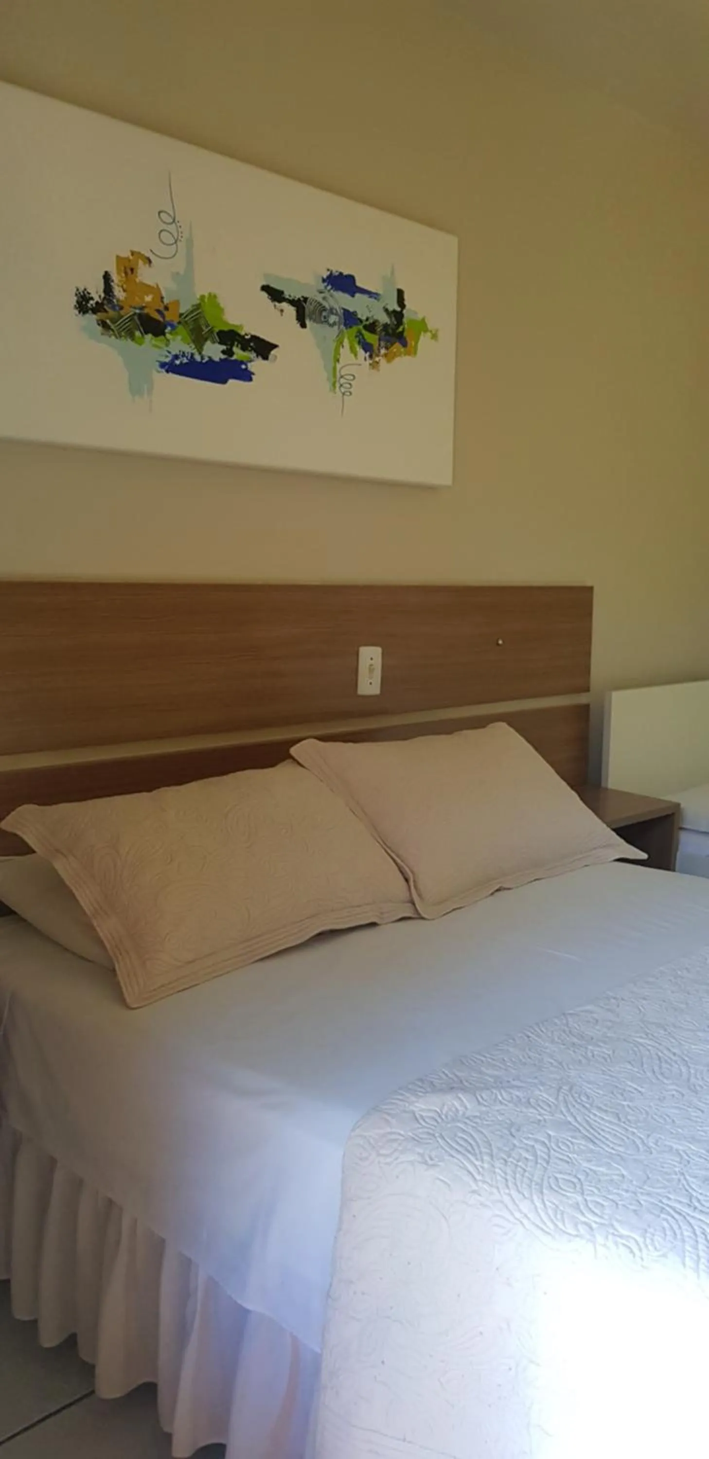 Bed in Pousada Guaruja