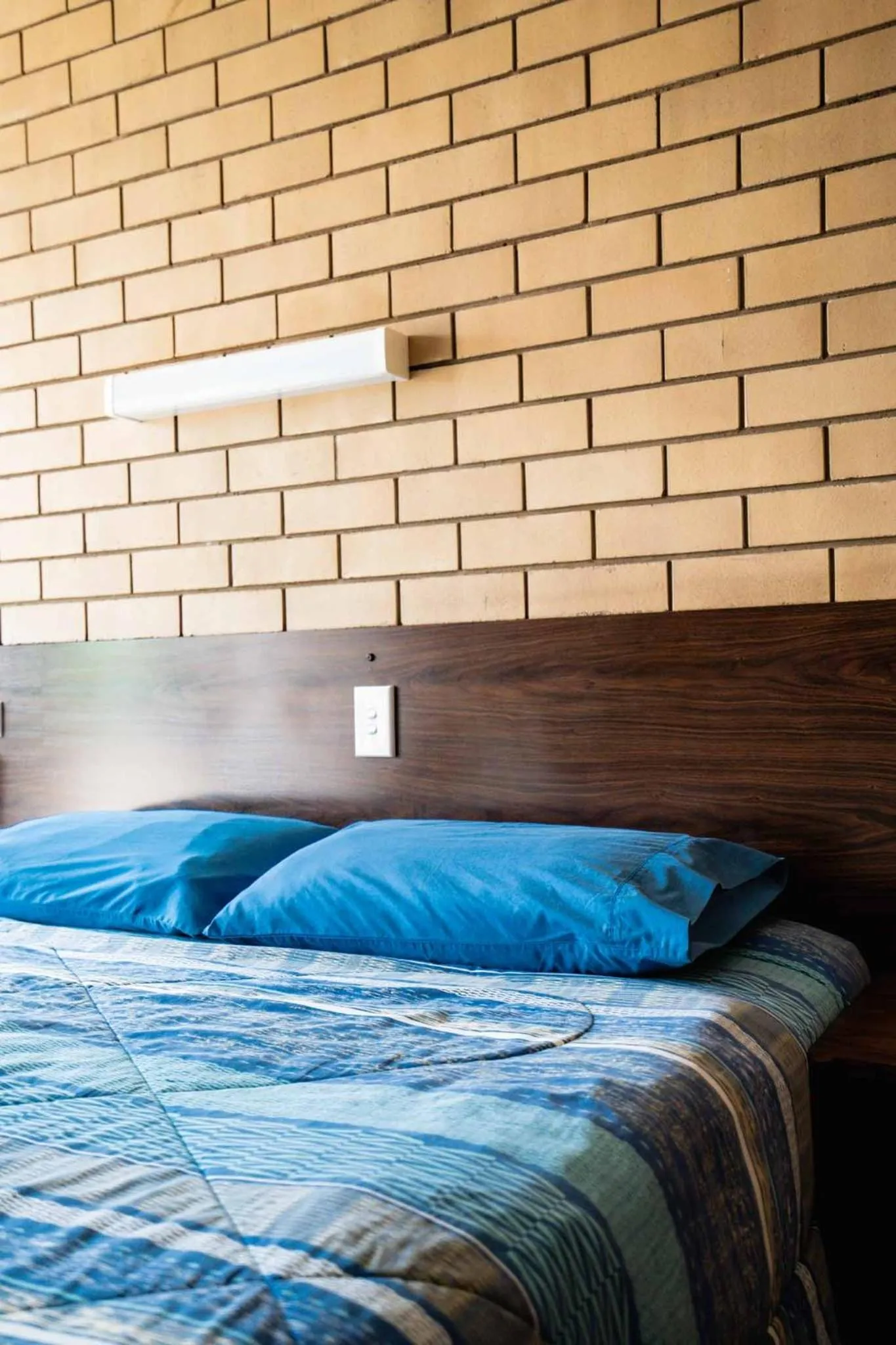 Bed in Grand Hotel Motel