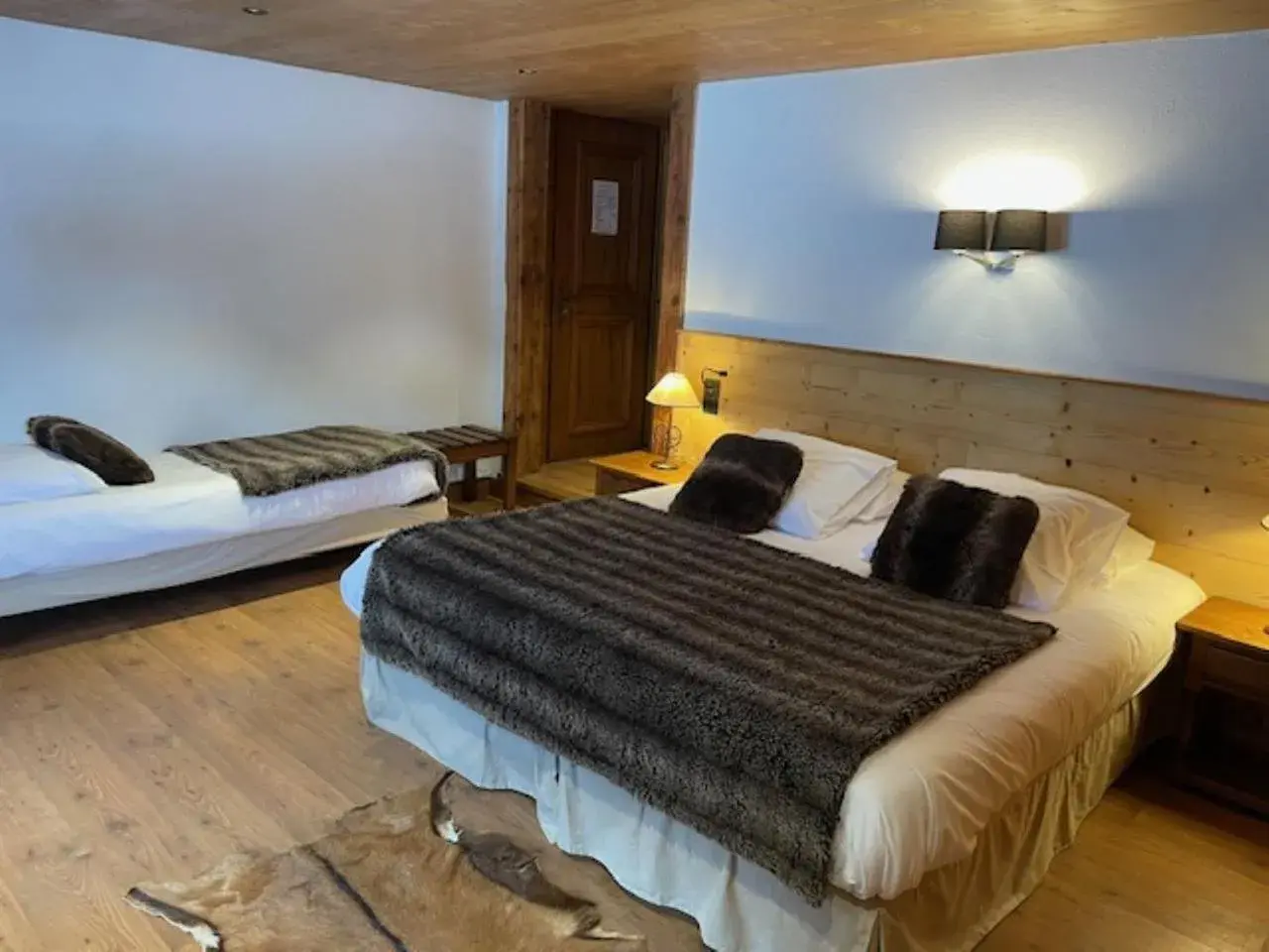 Triple Room with Pool View in Les Chalets de la Serraz Triple Room with Pool View in Les Chalets de la Serraz