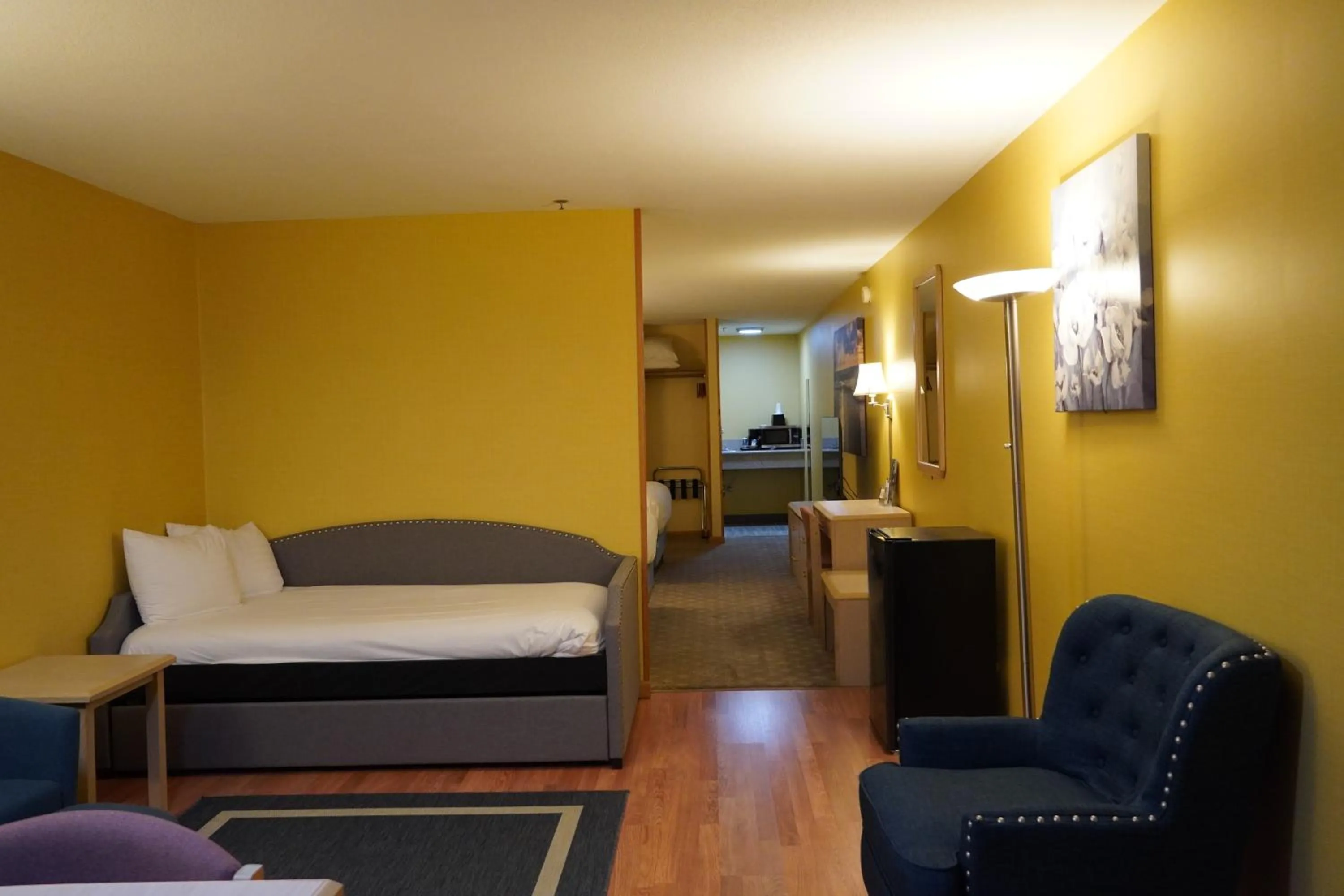 Bed in Timberland Inn & Suites