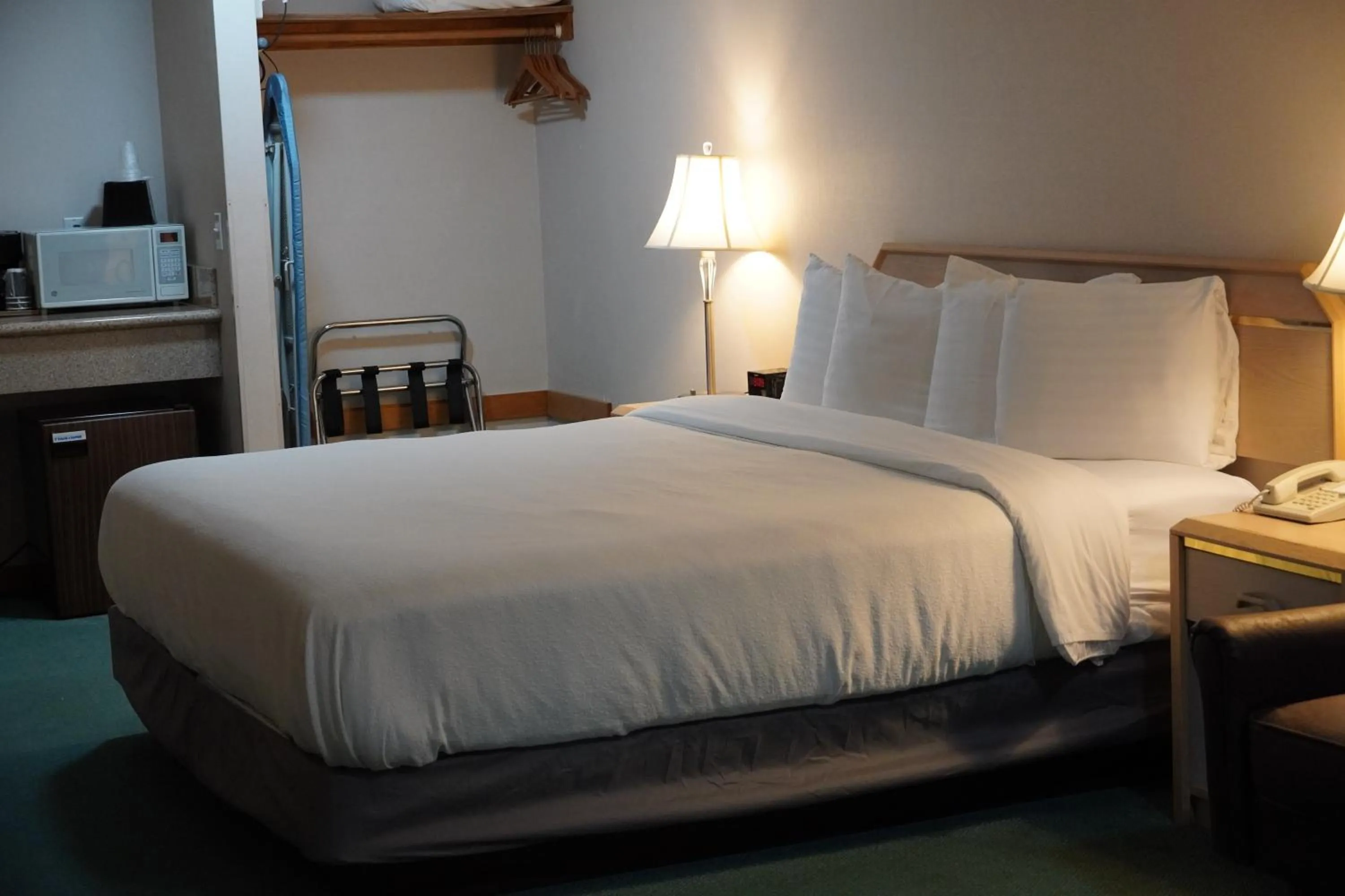 Bed in Timberland Inn & Suites