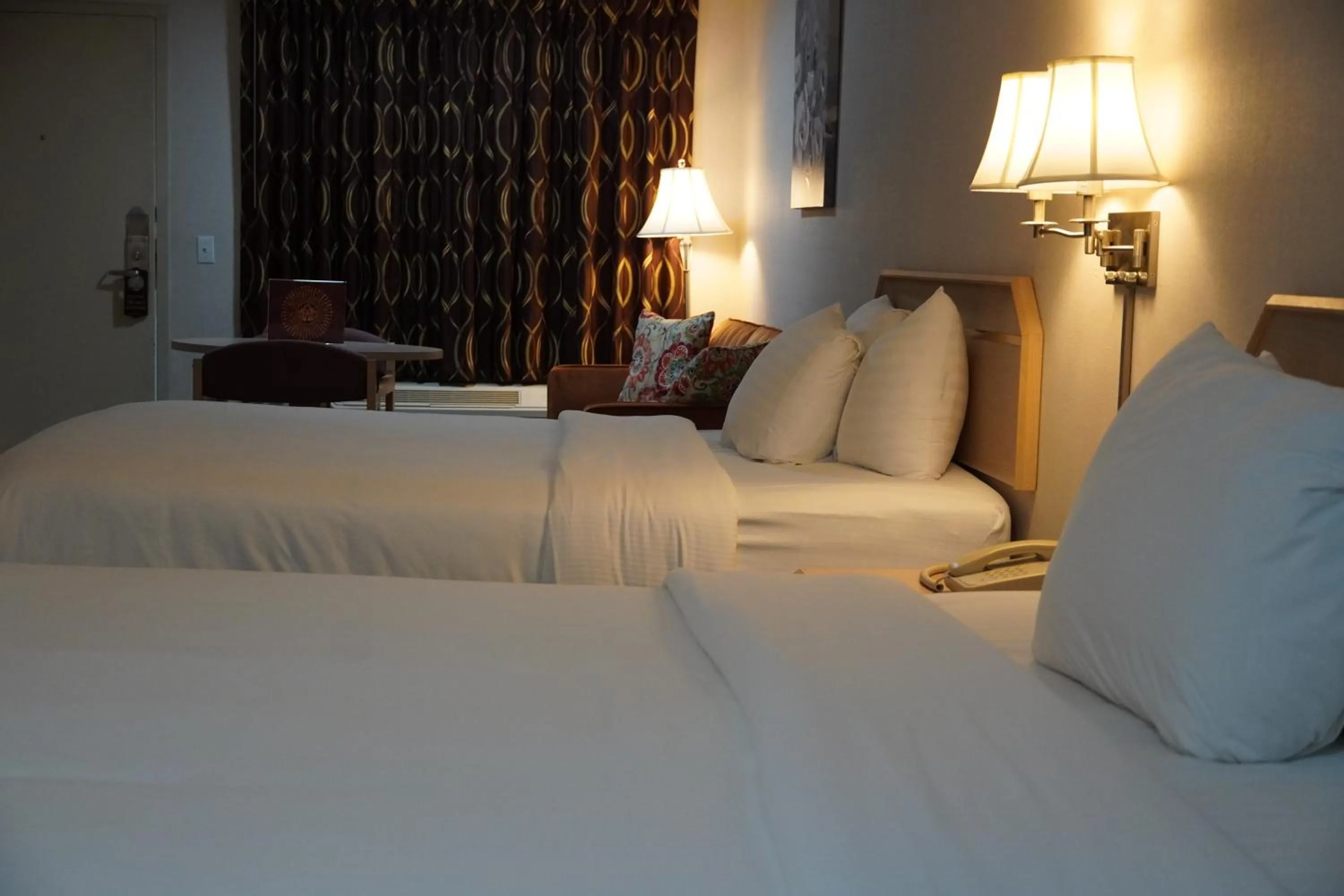 Bed in Timberland Inn & Suites