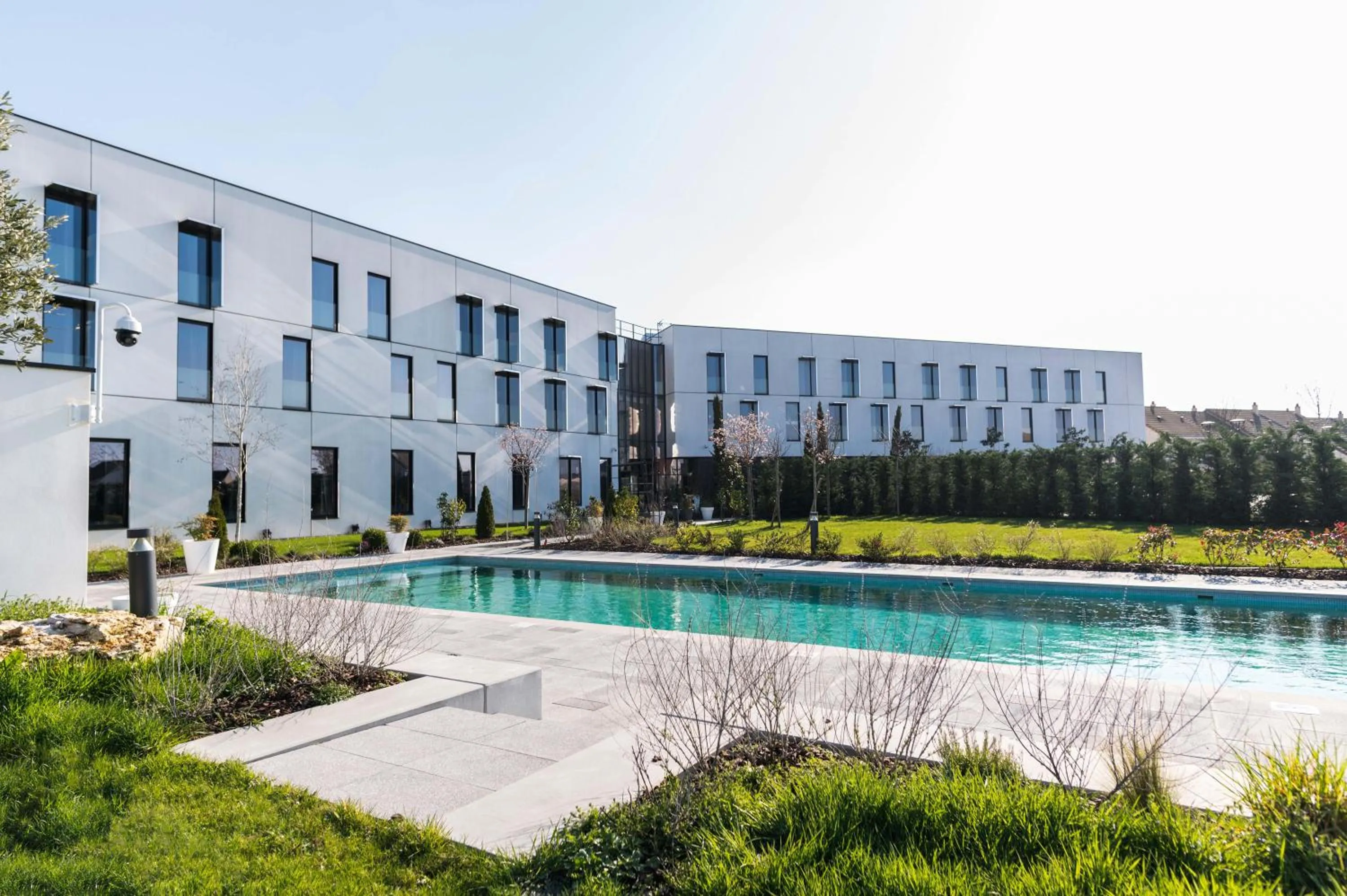 Swimming pool in Hotel Dali Val d'Europe, Tapestry Collection by Hilton