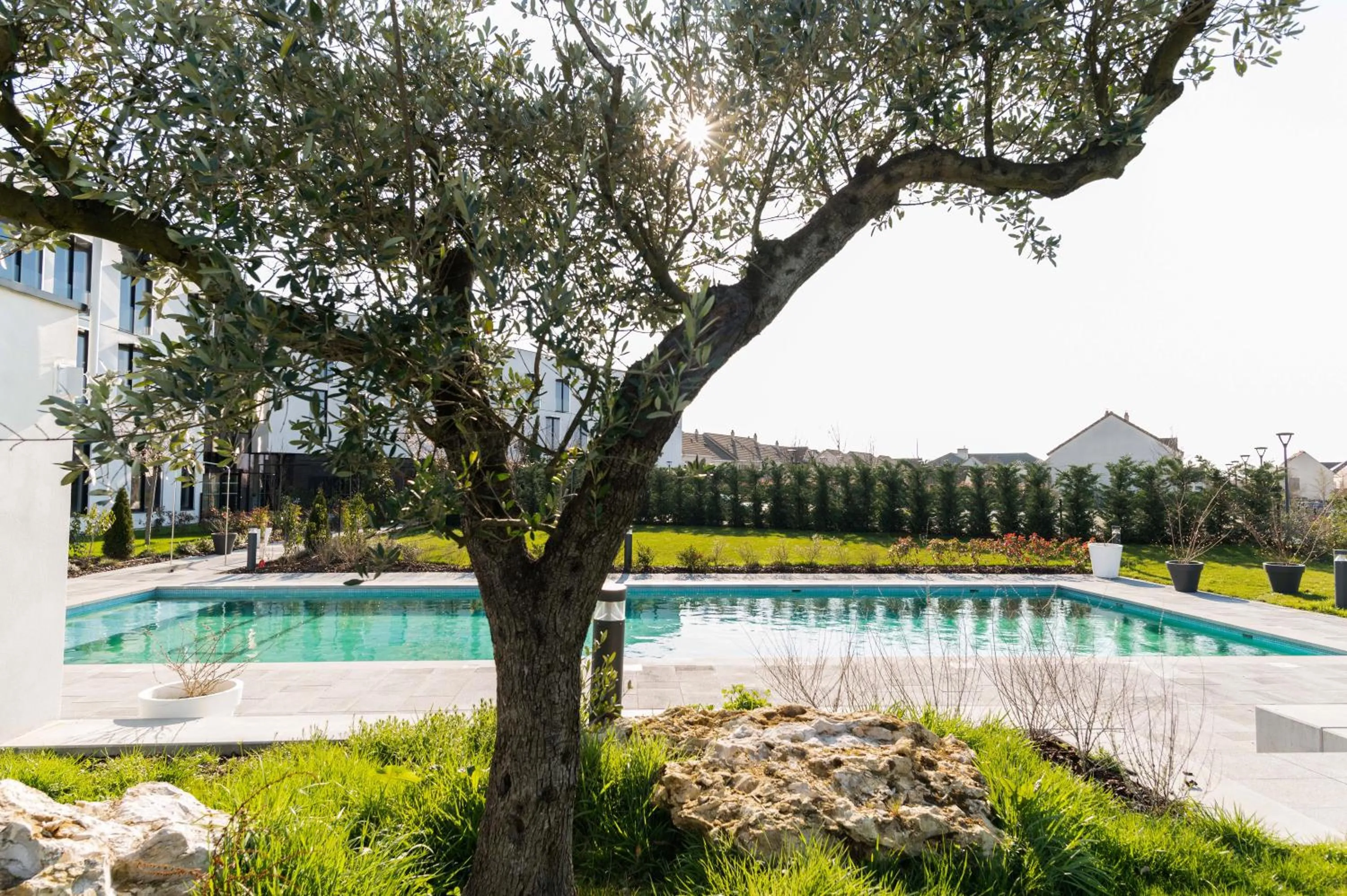 Swimming pool in Hotel Dali Val d'Europe, Tapestry Collection by Hilton