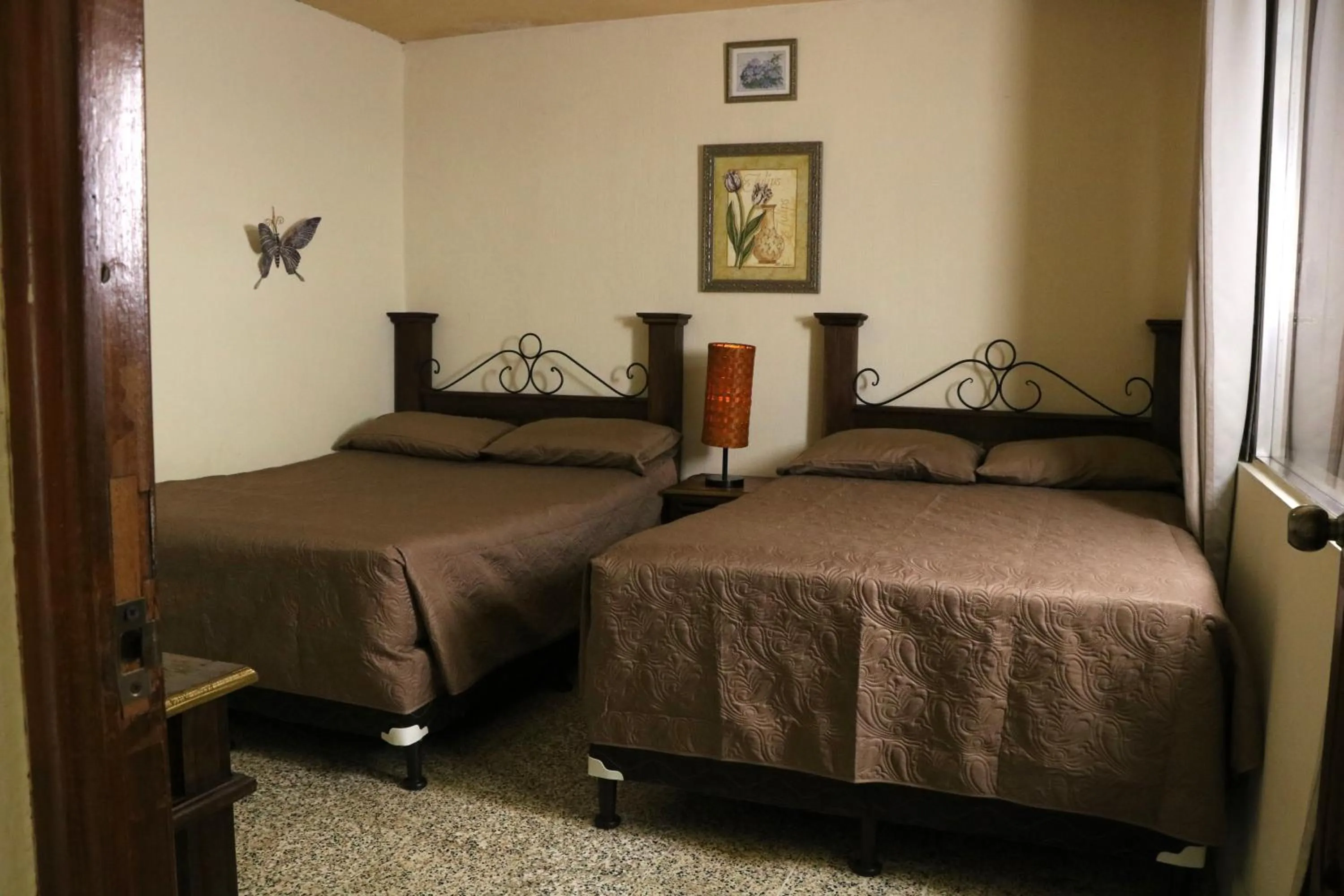 Bed in Hostal Los Volcanes