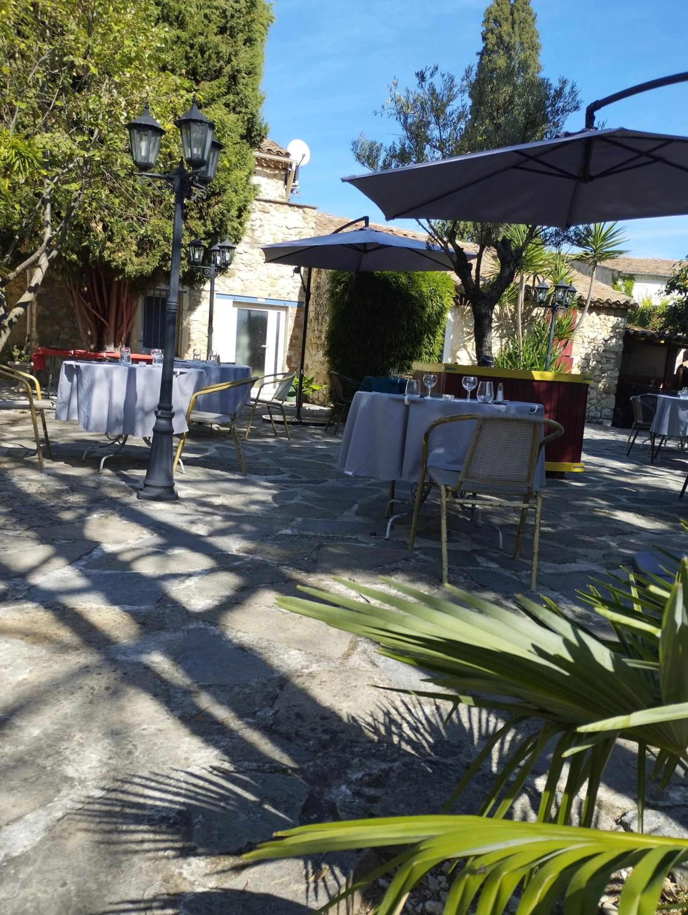 Patio in Logis Hotel Restaurant L'Esquielle