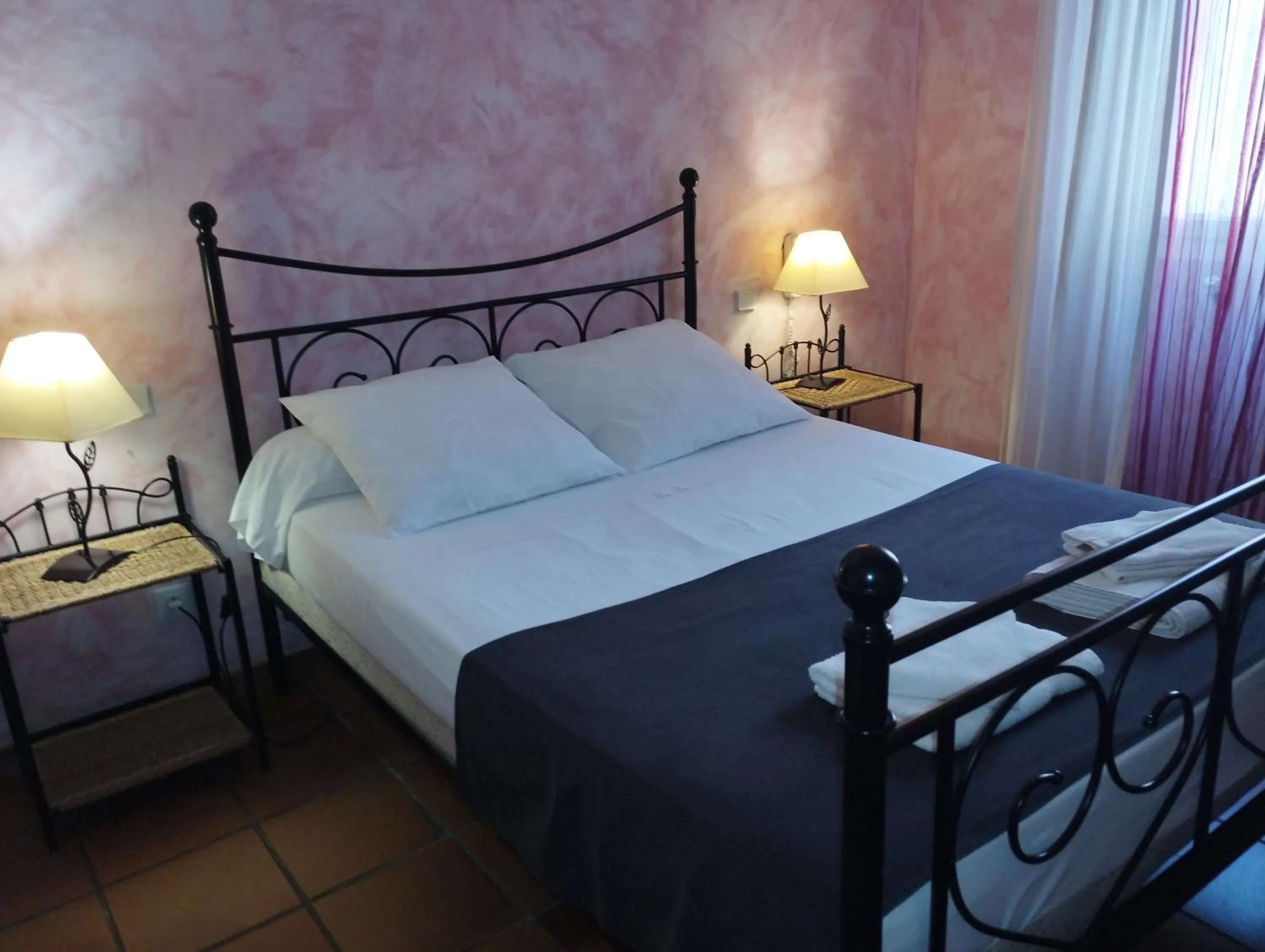 Bed in Logis Hotel Restaurant L'Esquielle