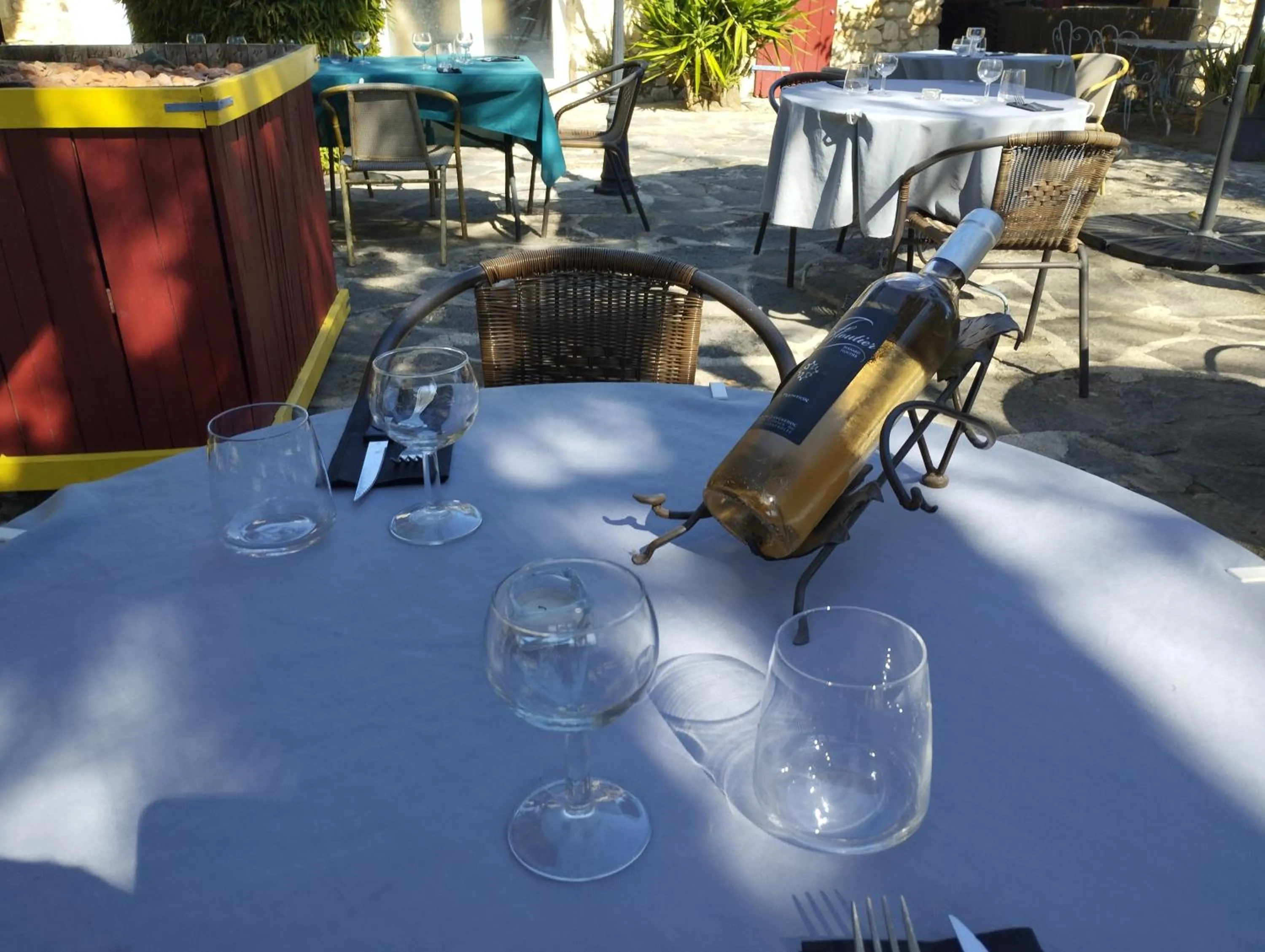 Patio in Logis Hotel Restaurant L'Esquielle