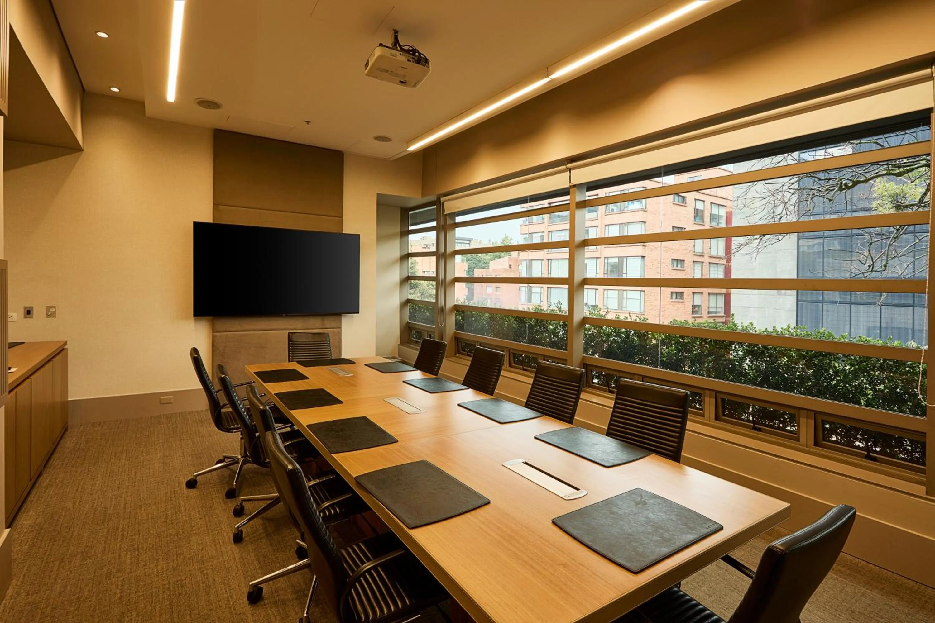 Communal lounge/ TV room in EK Hotel By Preferred Hotels Group