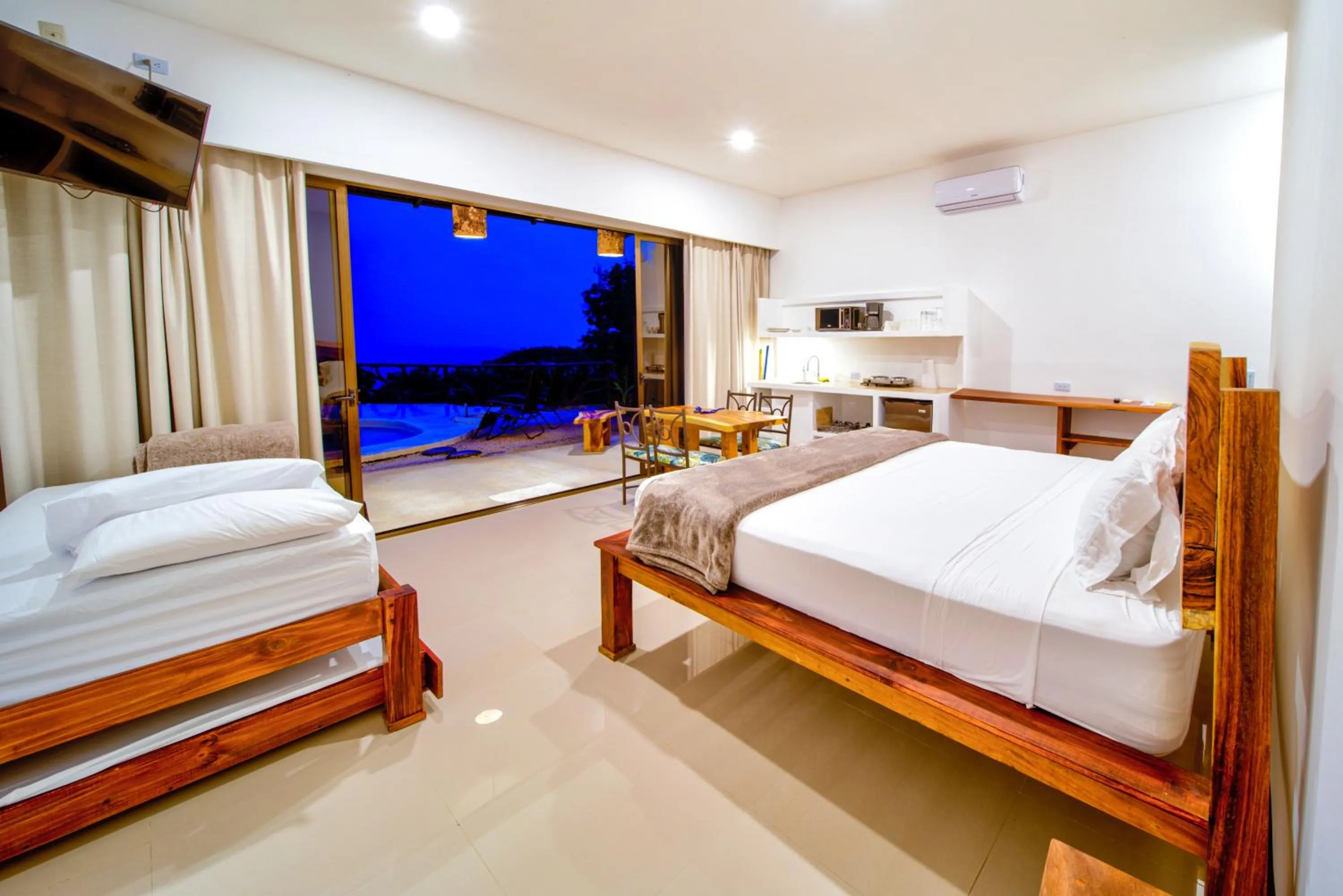 Photo of the whole room, Bed in Akua Suites Ocean View