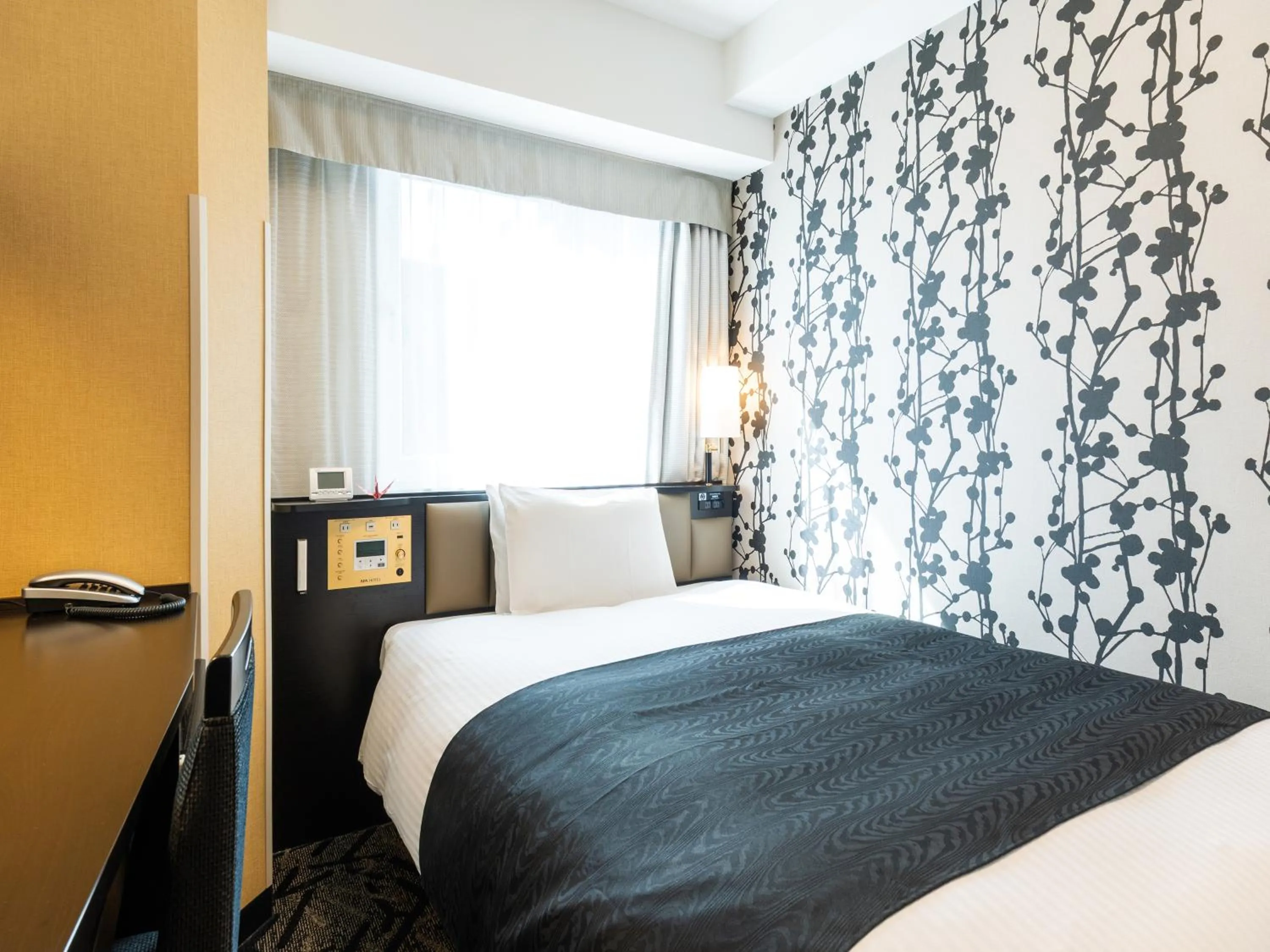 Photo of the whole room, Bed in APA Hotel Osaka Kadomashi Ekimae