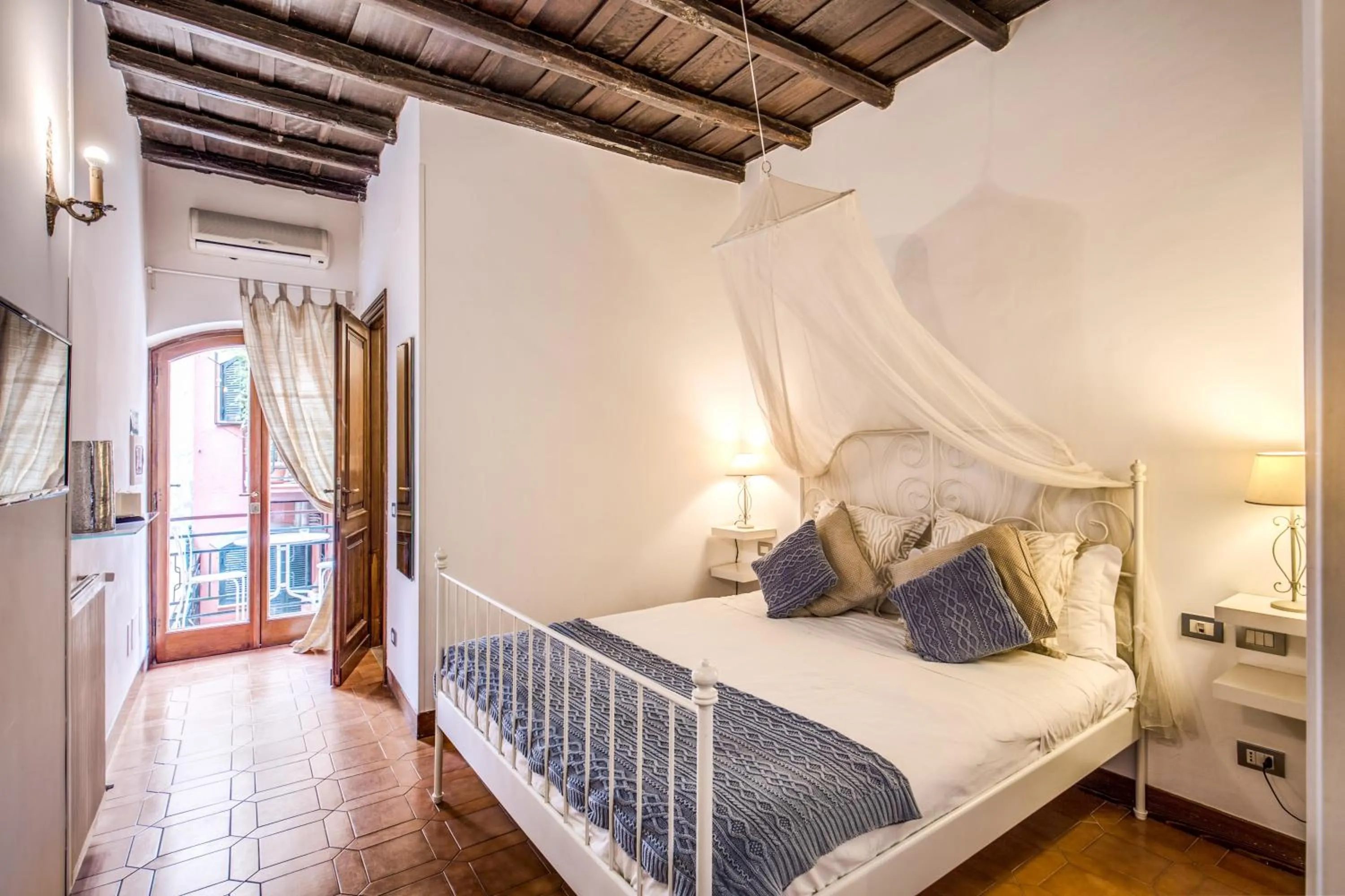 Bedroom, Bed in Elegant Apartment Behind the Colosseum