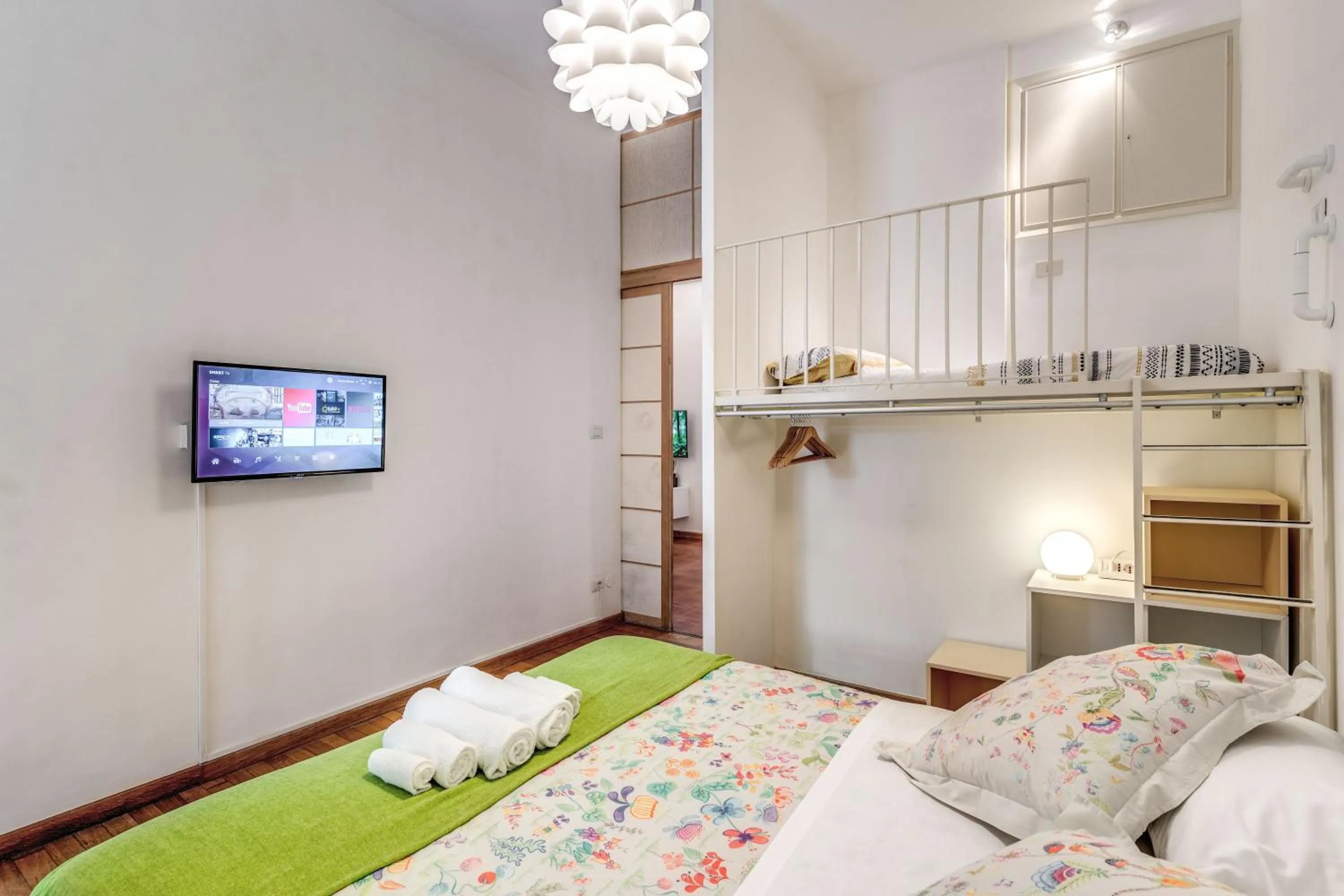 Photo of the whole room, Bed in Elegant Apartment Behind the Colosseum