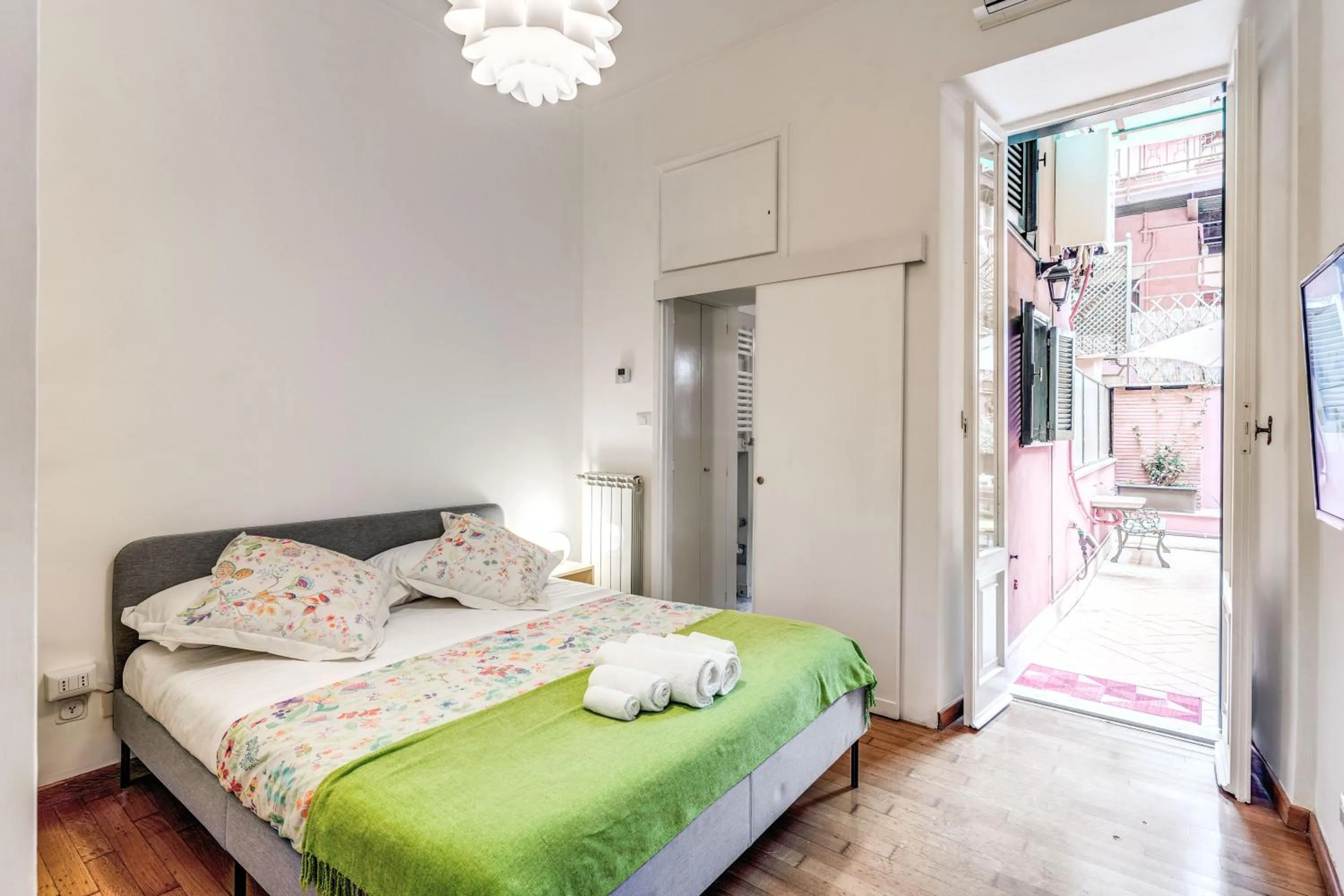 Photo of the whole room, Bed in Elegant Apartment Behind the Colosseum