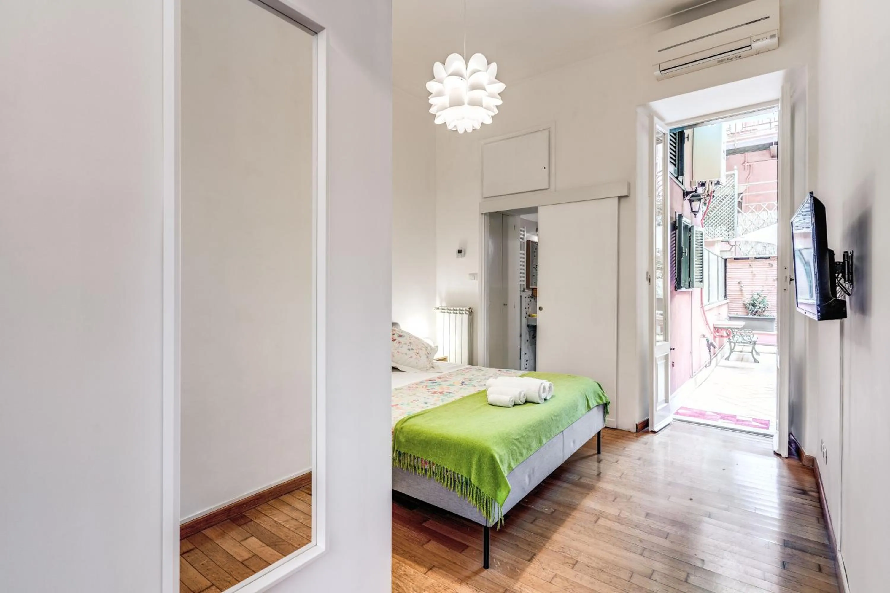 Photo of the whole room, Bed in Elegant Apartment Behind the Colosseum