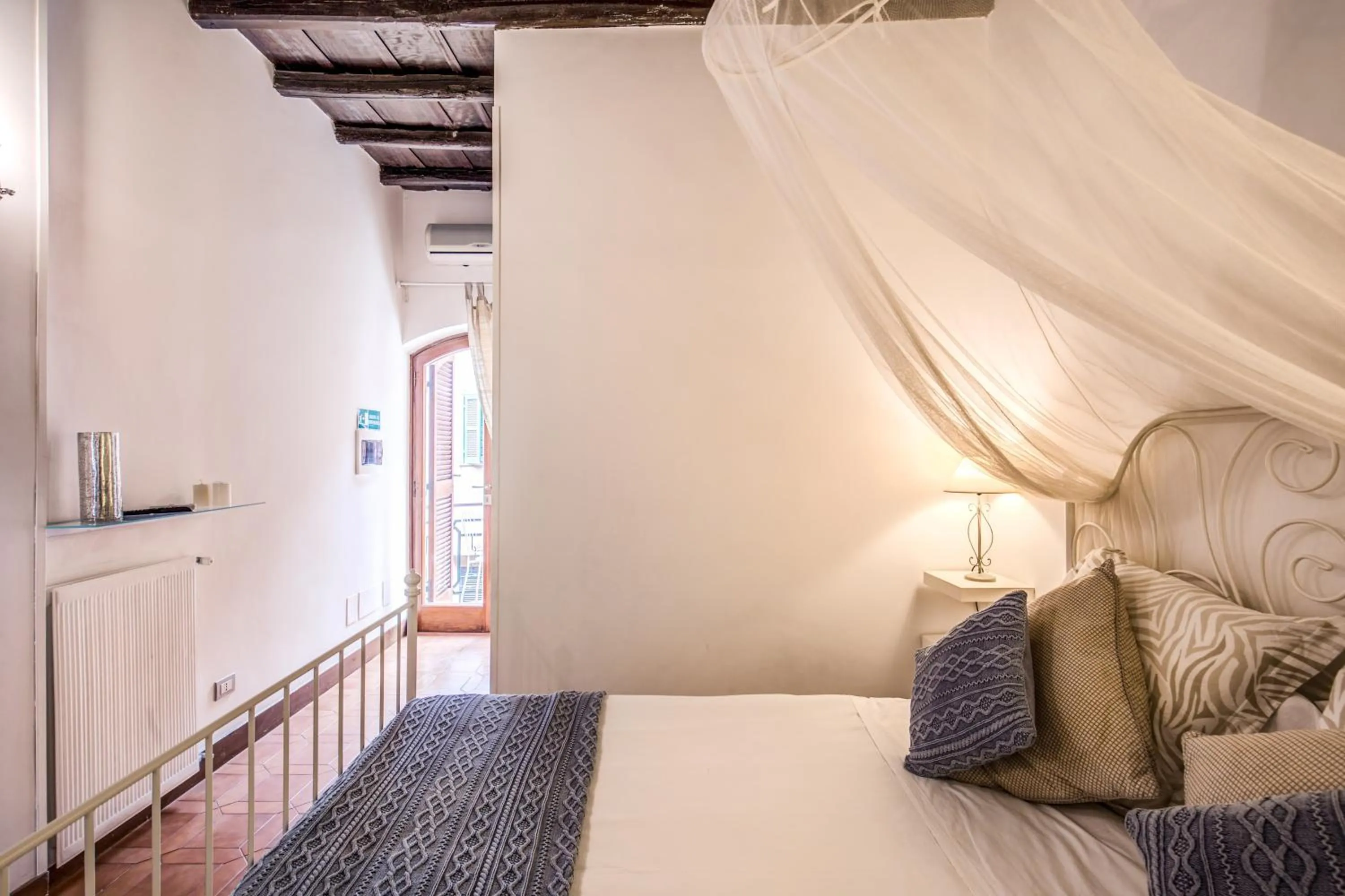 Bedroom, Bed in Elegant Apartment Behind the Colosseum