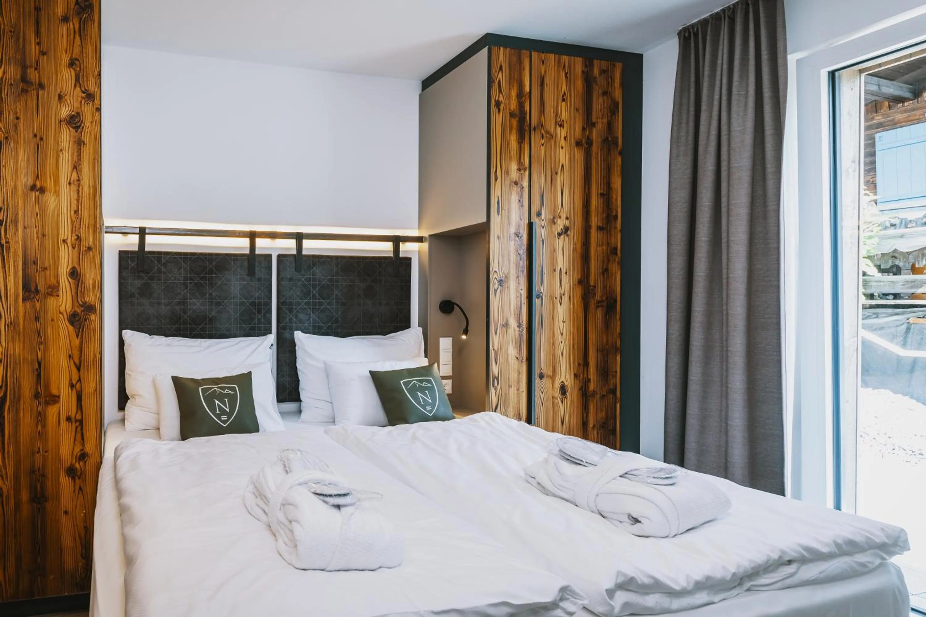 Bed in Nikolaus by AvenidA Panoramic Wellness Suites