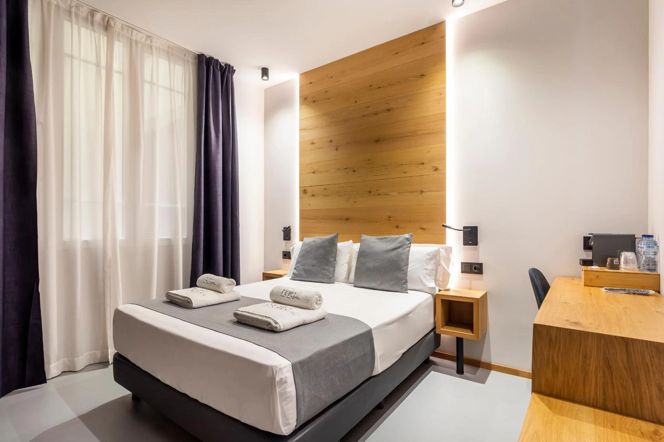 Bed in NALU Valencia Boutique Rooms