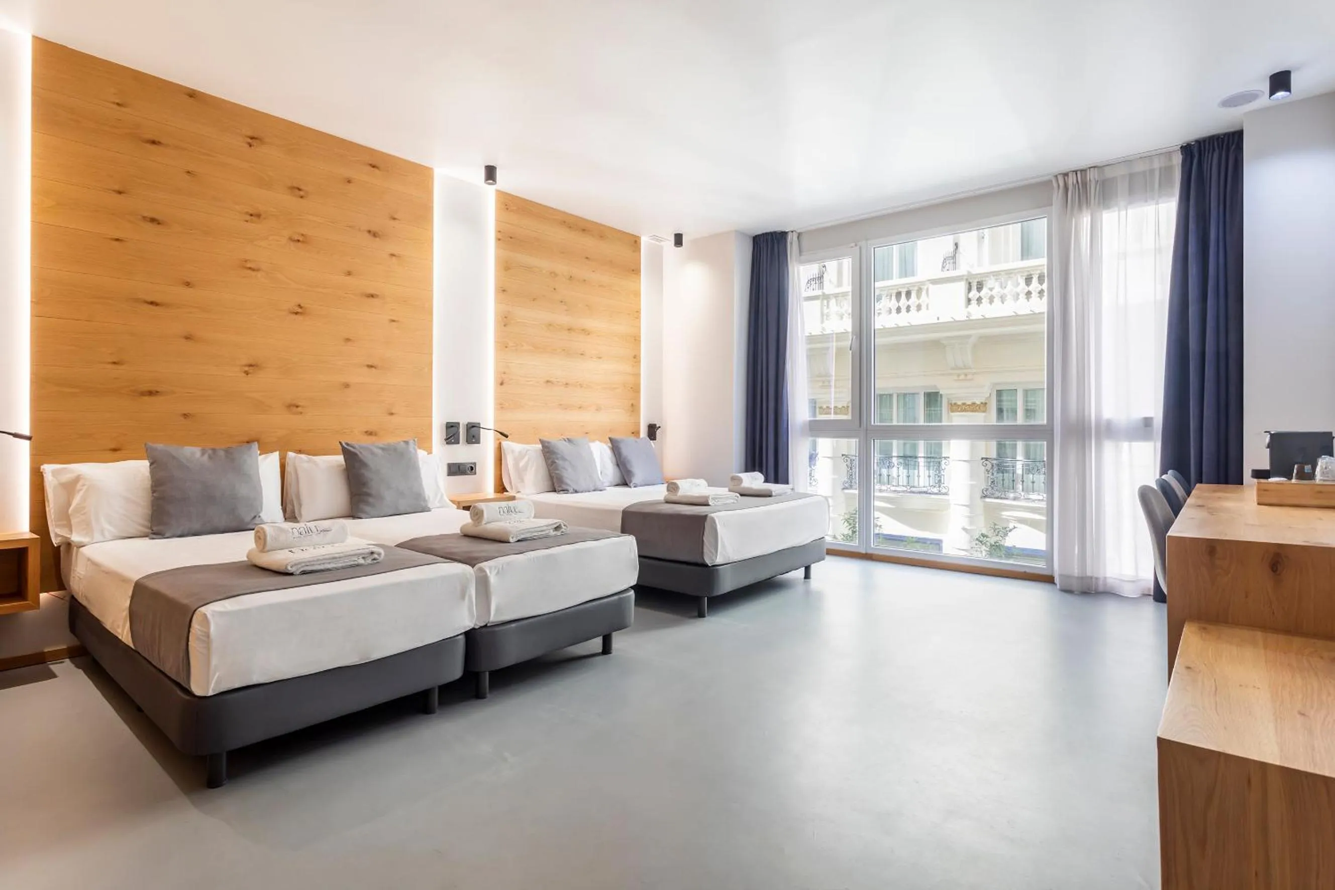 Bed in NALU Valencia Boutique Rooms