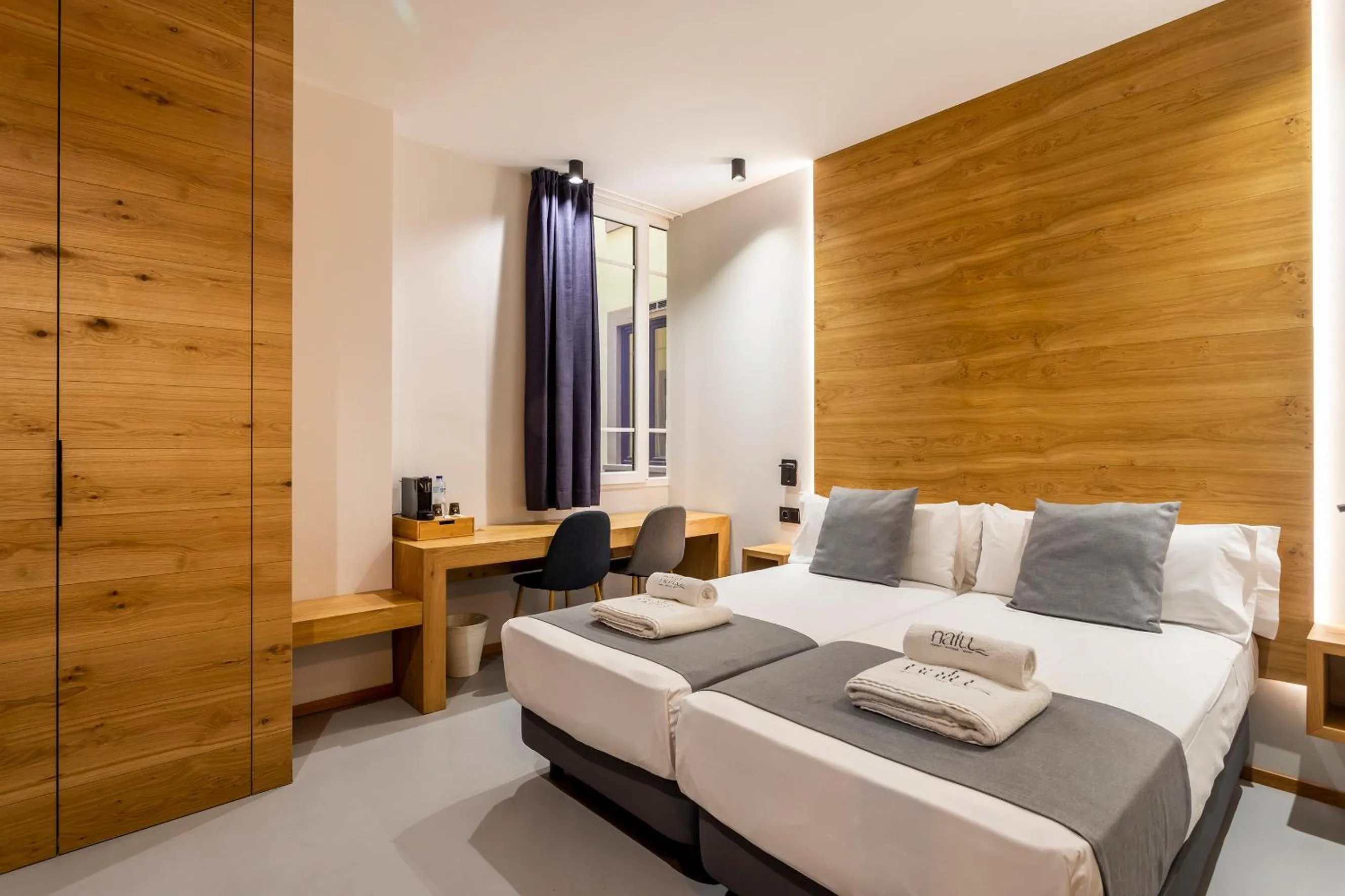 Bed in NALU Valencia Boutique Rooms