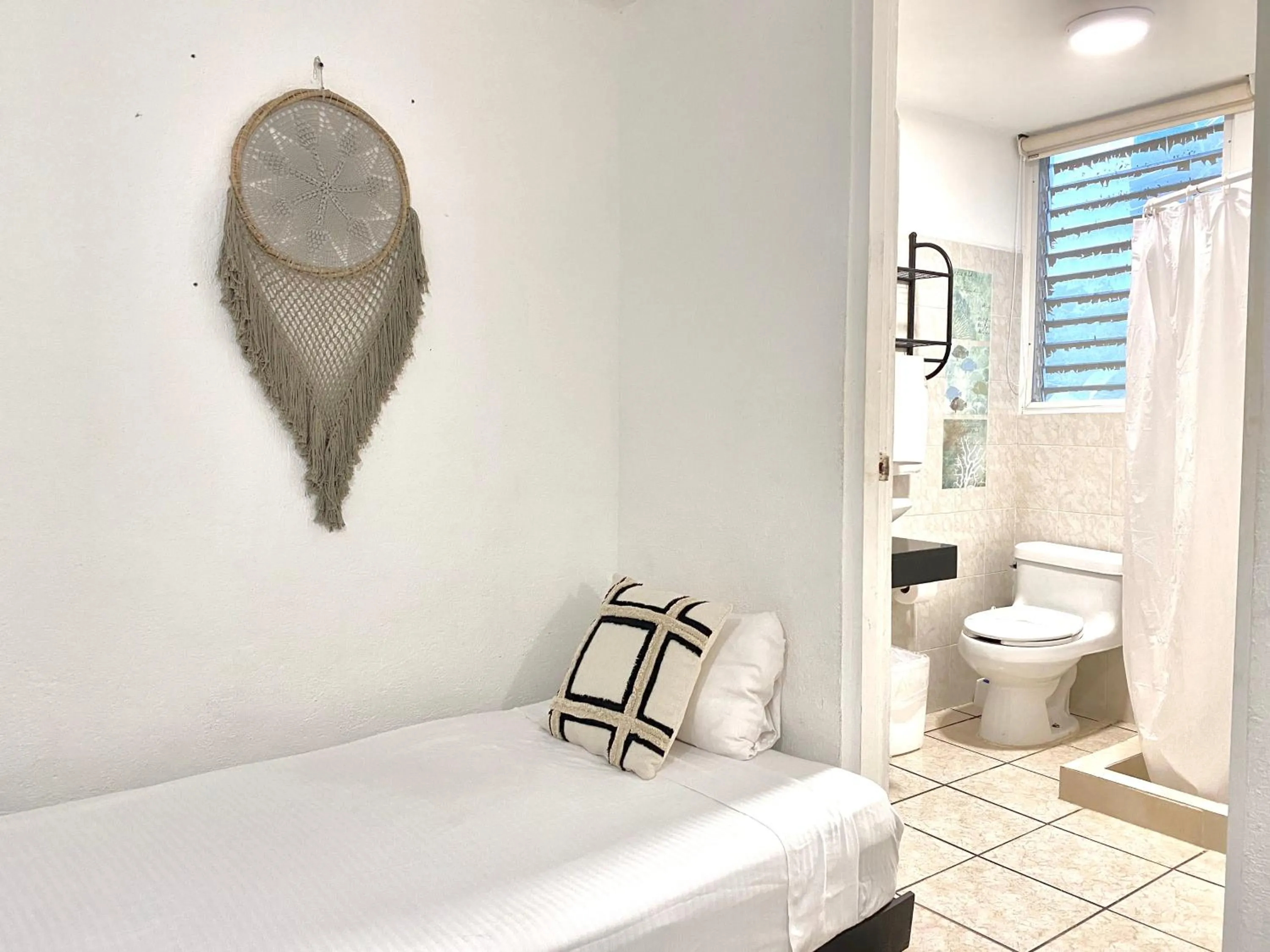 Bathroom, Bed in Coco Suites by Andiani Travel