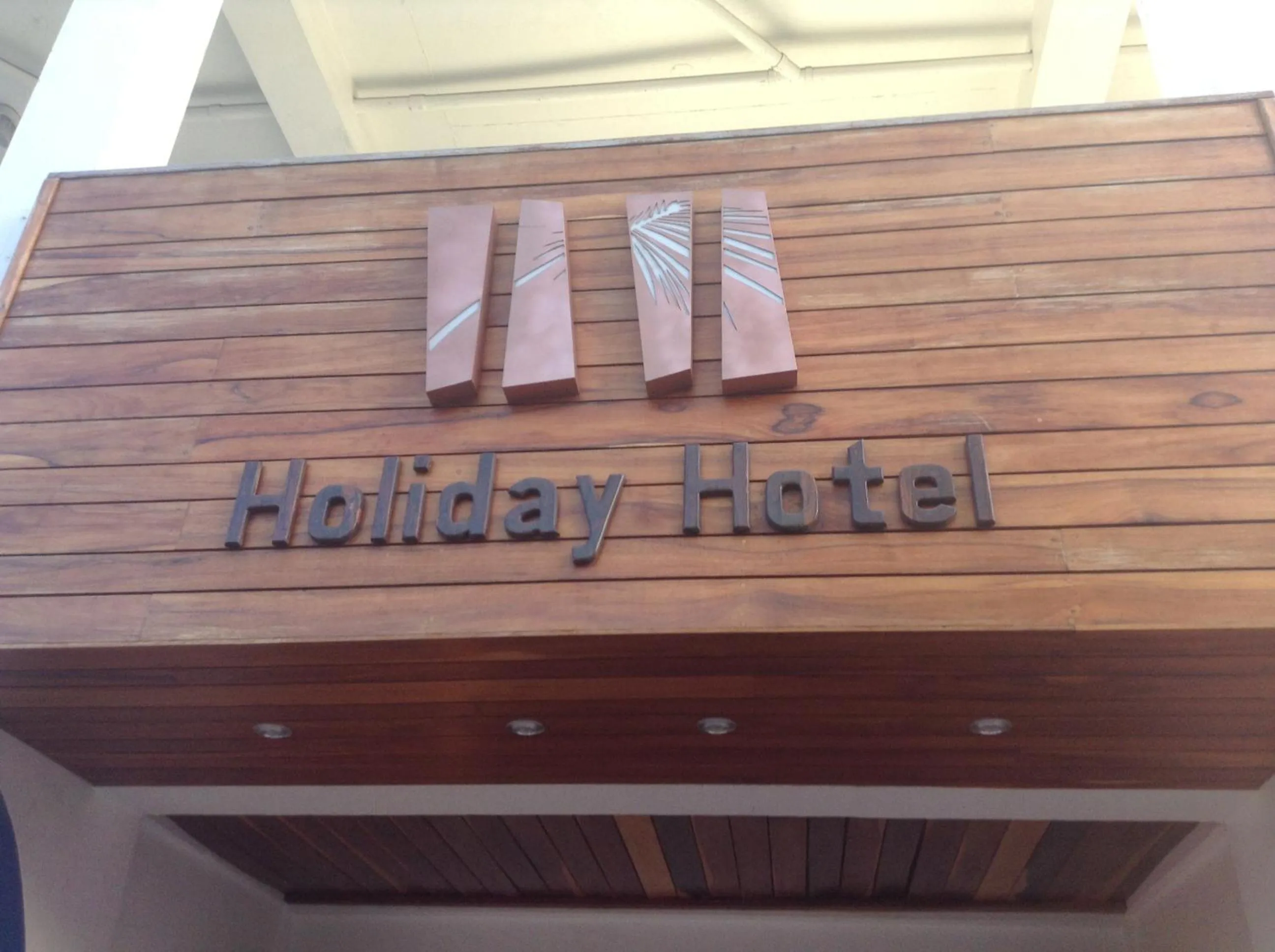 Property logo or sign in Holiday Hotel