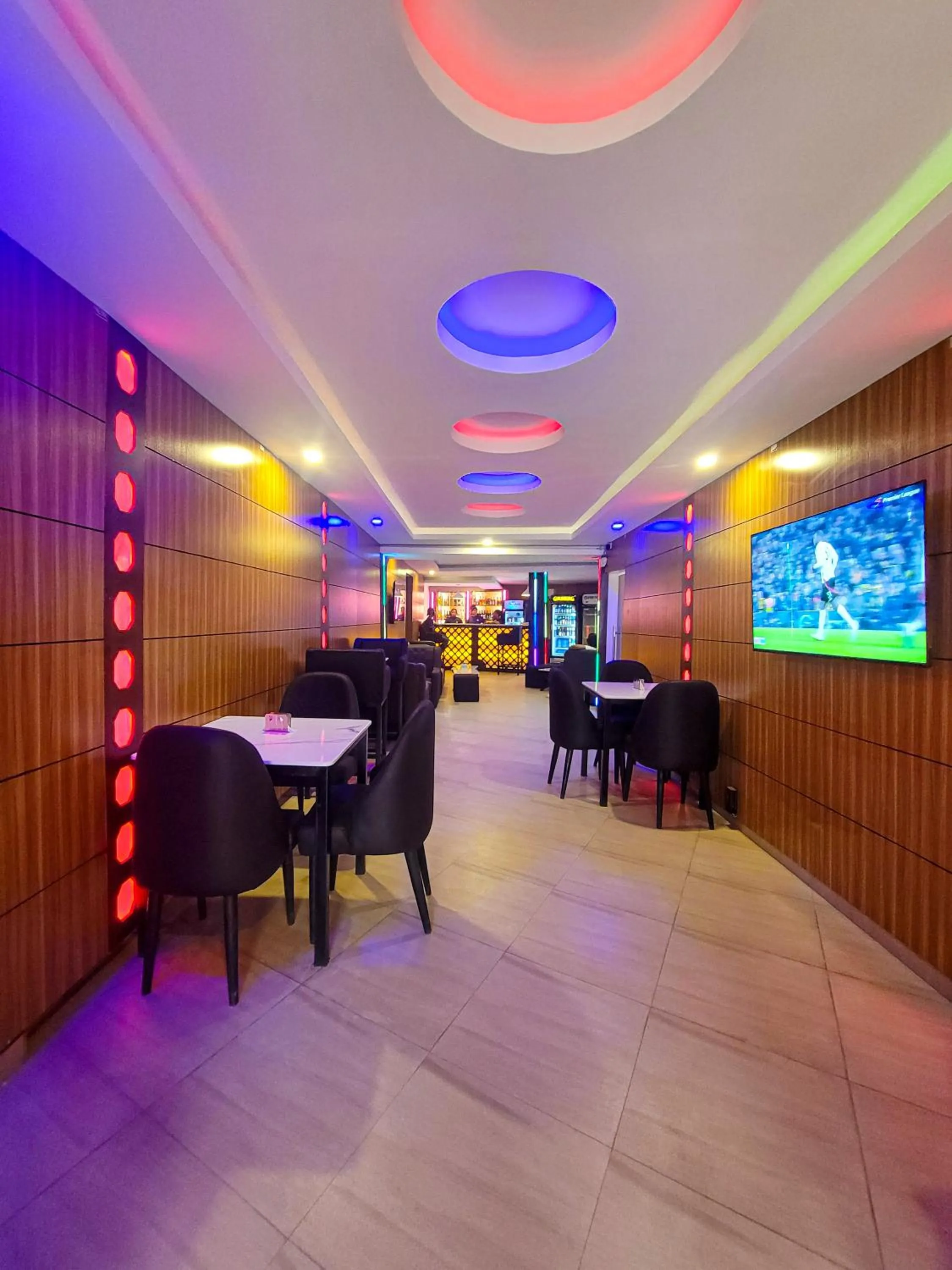 Communal lounge/ TV room in Presken Hotel Alade, Ikeja