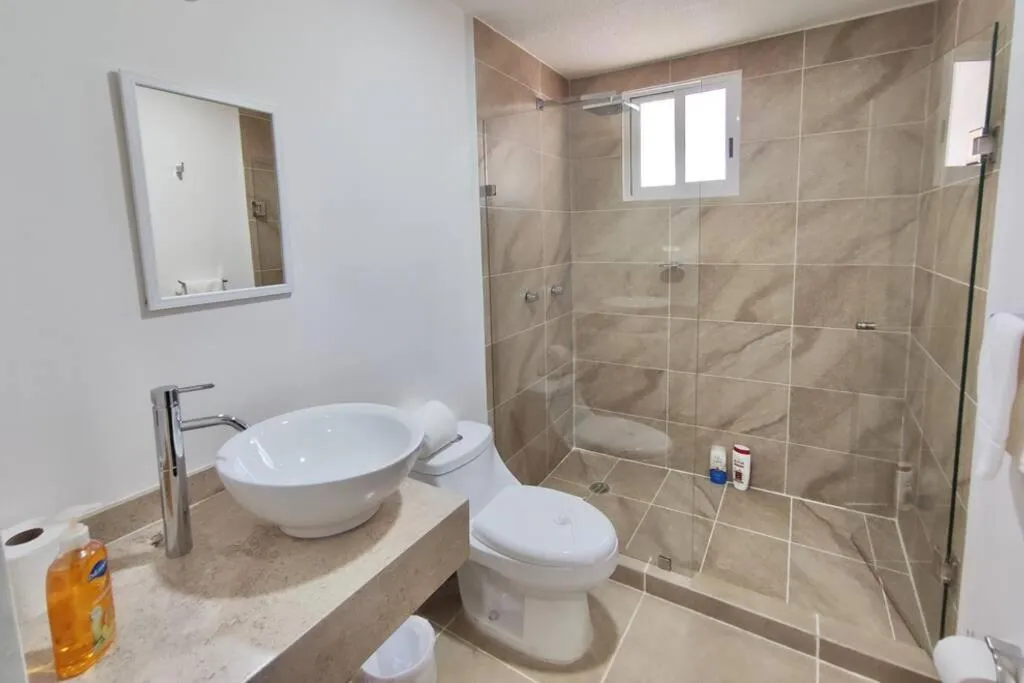 Shower in Dreams Lagoon by Andiani Travel