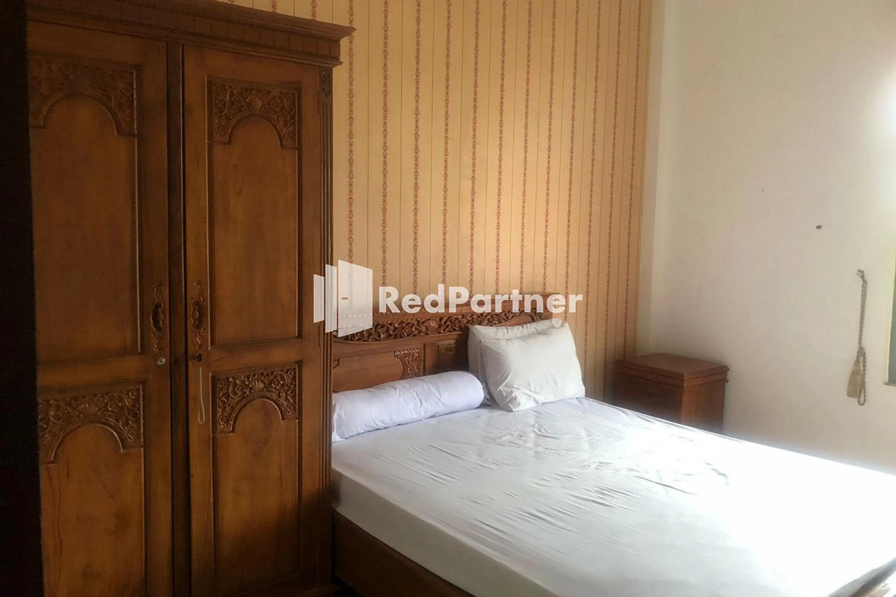 Bed in Hotel Abna Sangatta Mitra RedDoorz