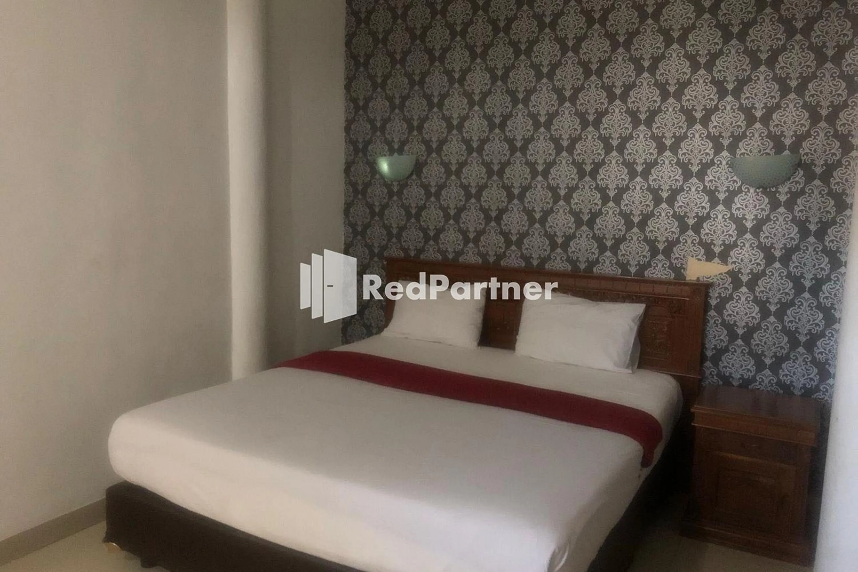 Bed in Hotel Abna Sangatta Mitra RedDoorz