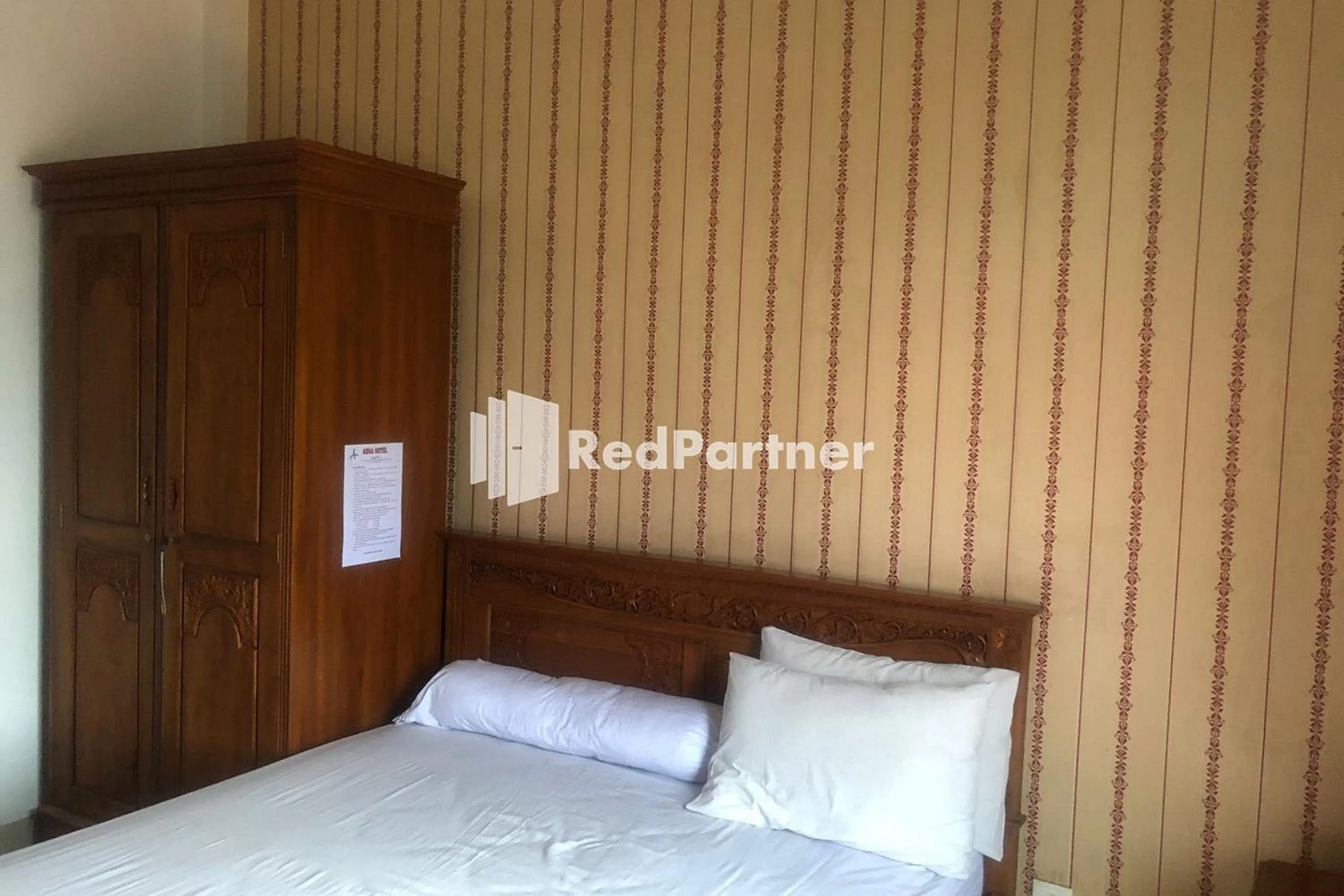 Bed in Hotel Abna Sangatta Mitra RedDoorz