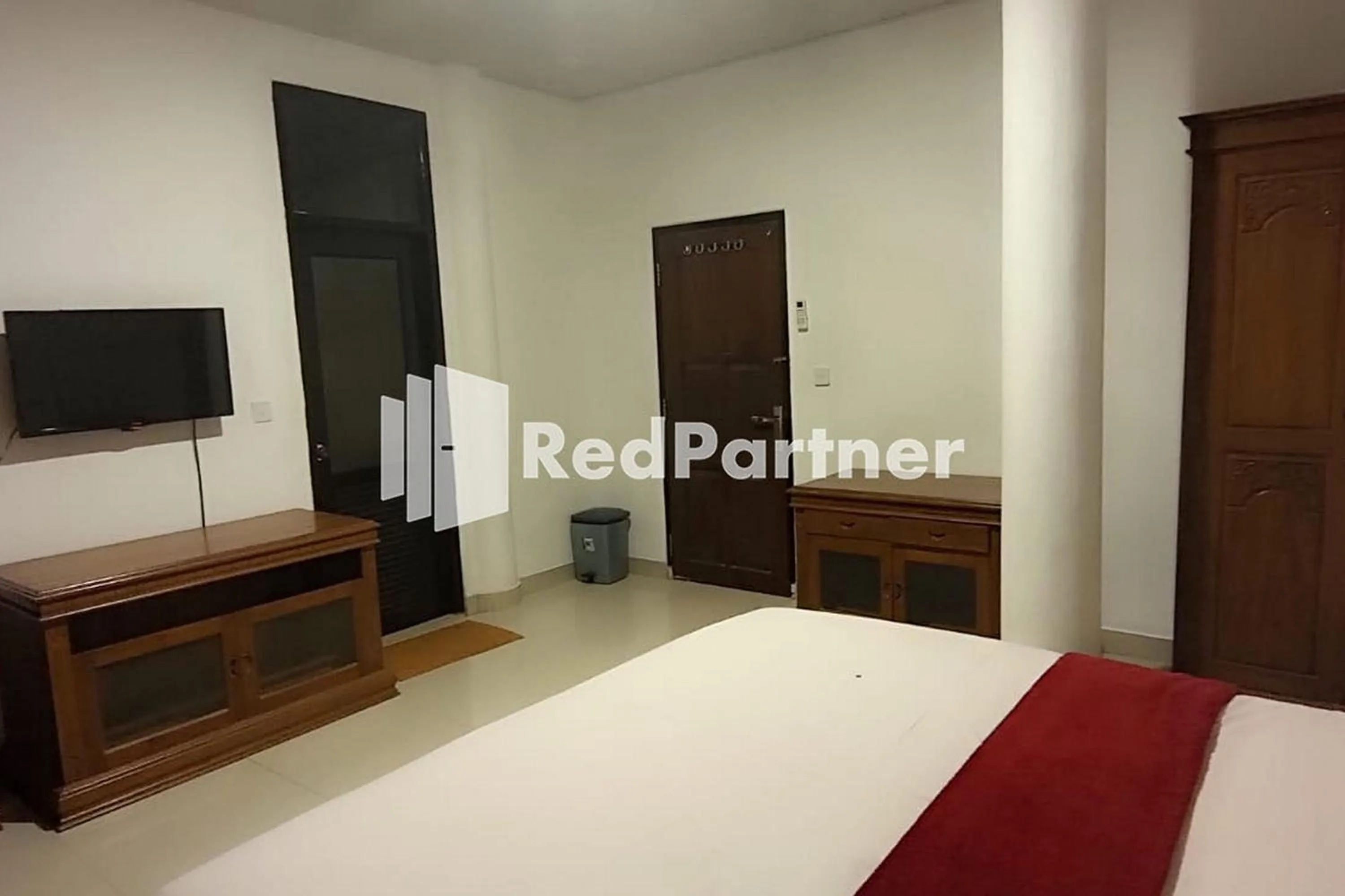 Bed in Hotel Abna Sangatta Mitra RedDoorz