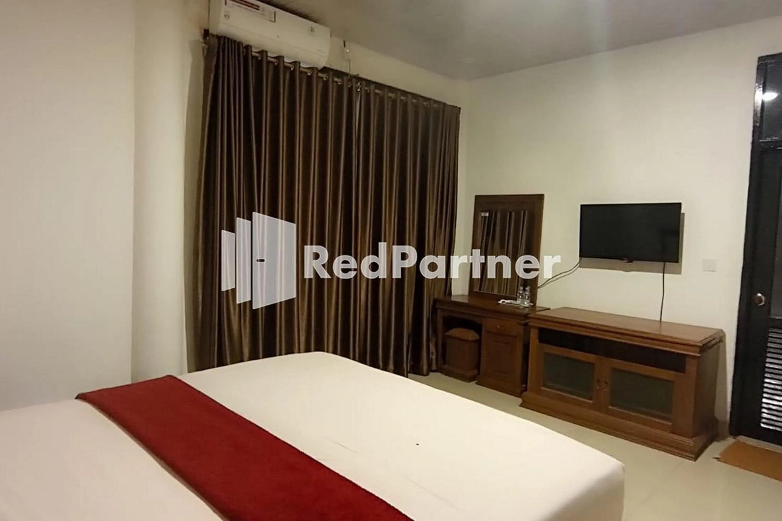 Bed in Hotel Abna Sangatta Mitra RedDoorz