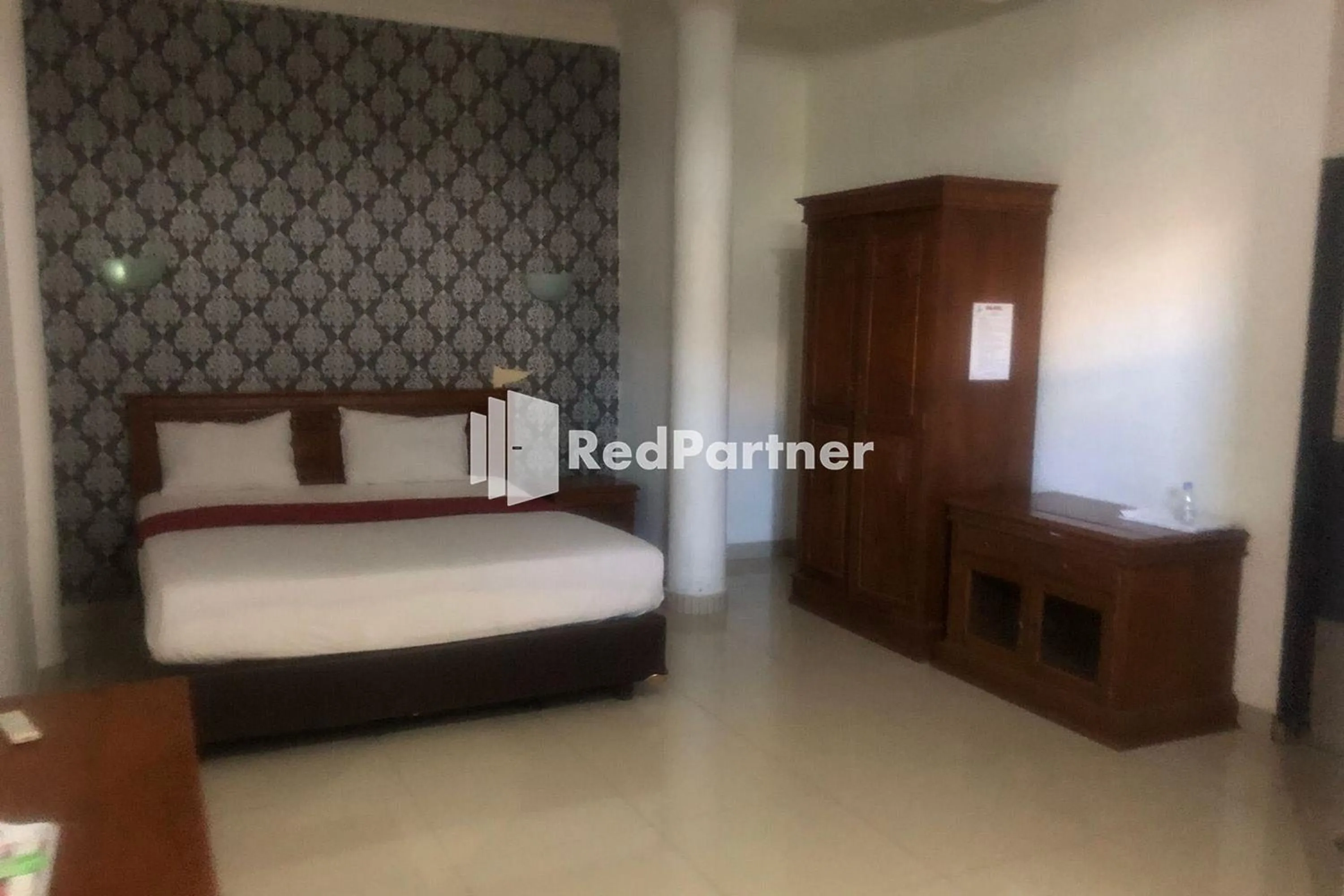 Bed in Hotel Abna Sangatta Mitra RedDoorz