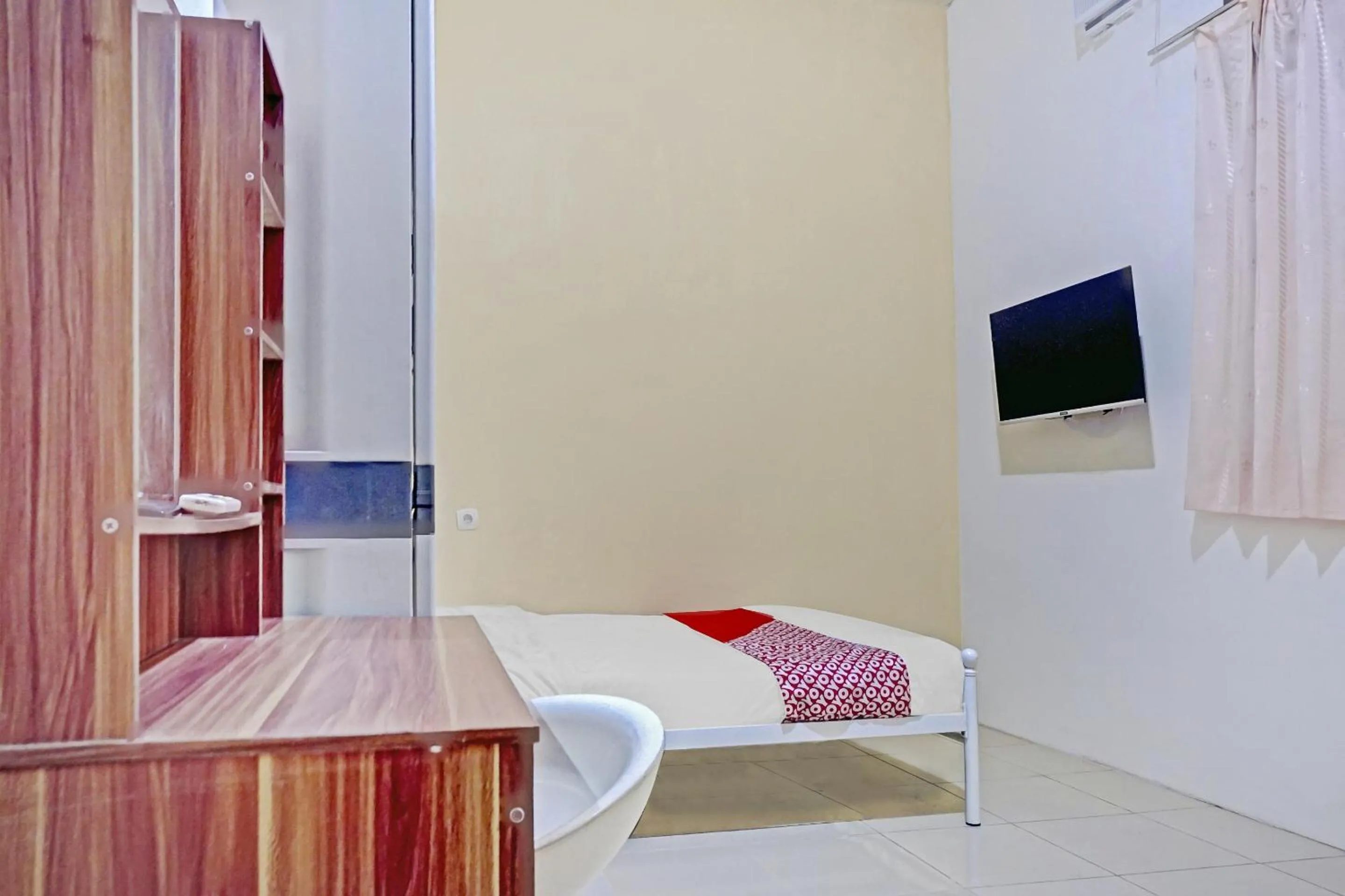 Bedroom in Hotel O Lily House