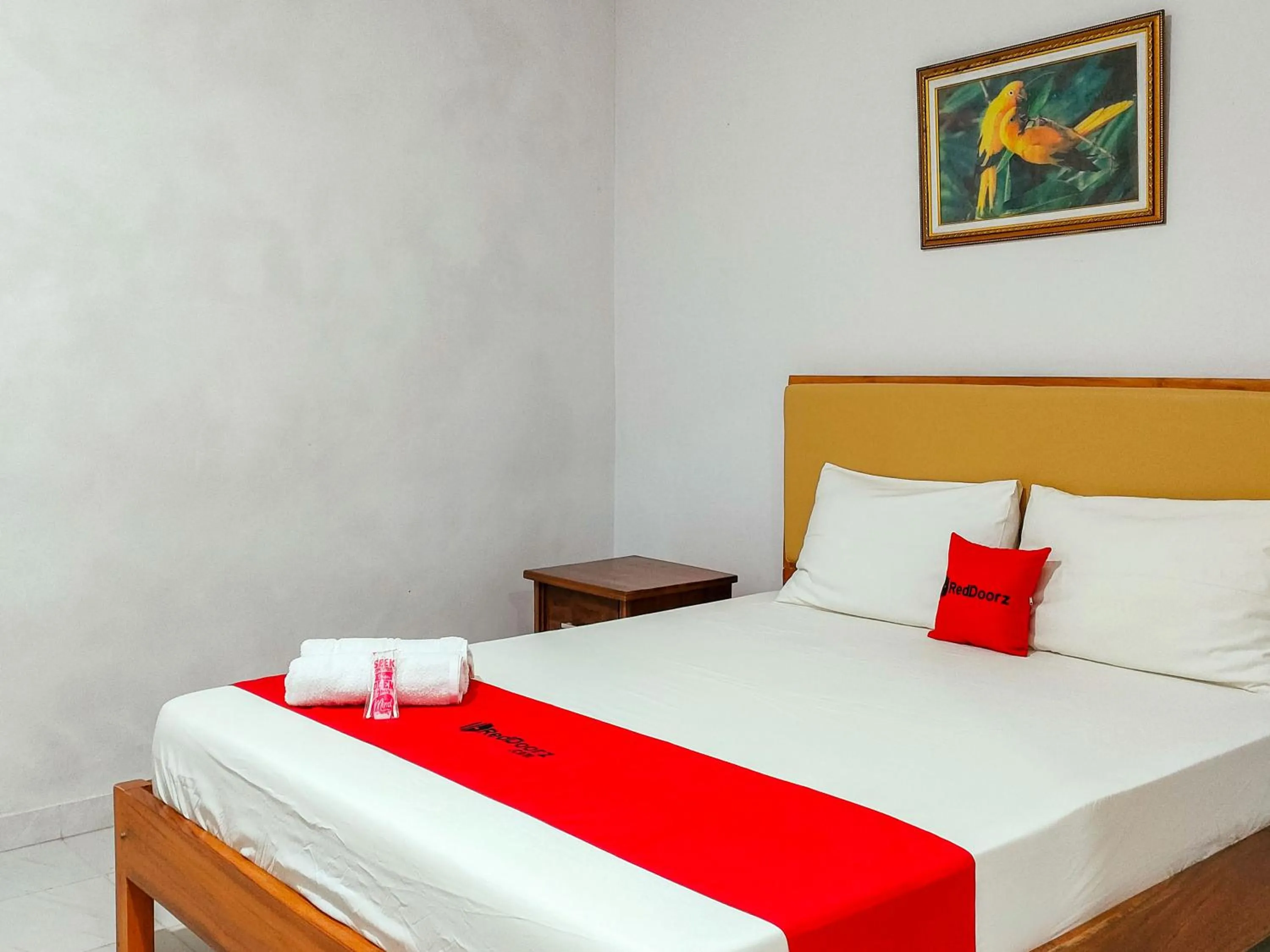 Bed in RedDoorz at Omah Candi Sari near Airport YIA