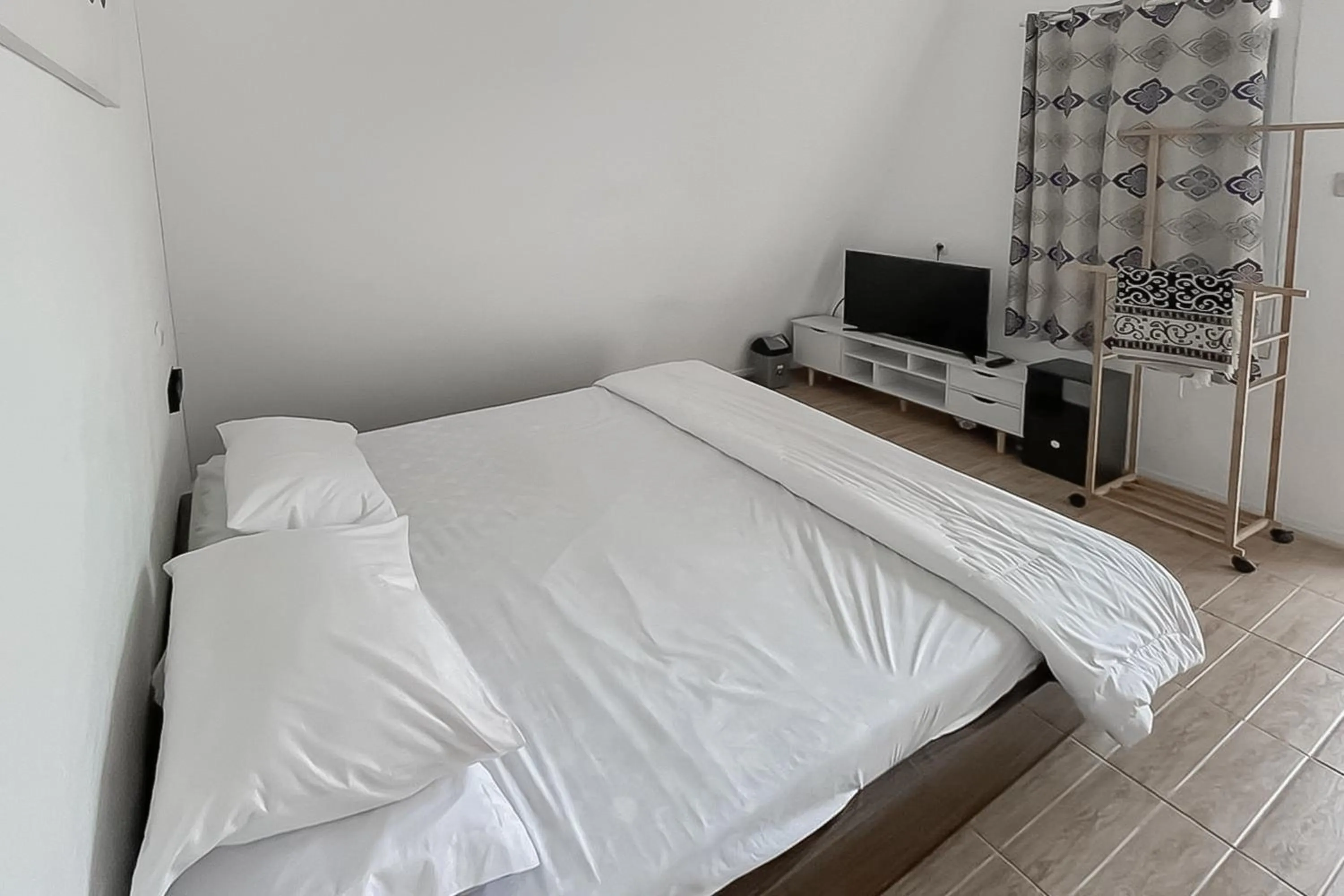 Bed in RedDoorz Resort Syariah At Rancakalong Sumedang