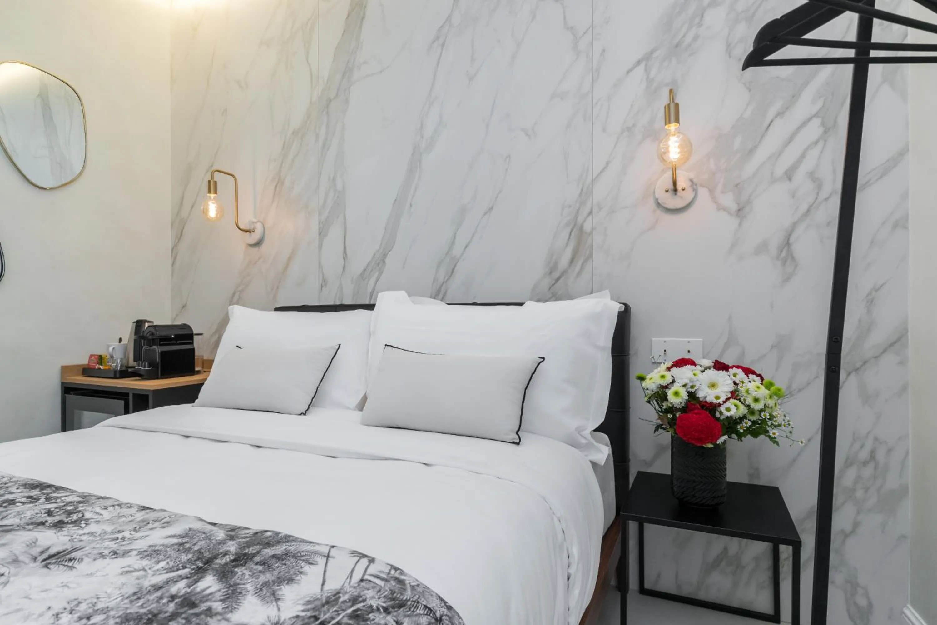 Bed in Le Dortoir Boutique Suites