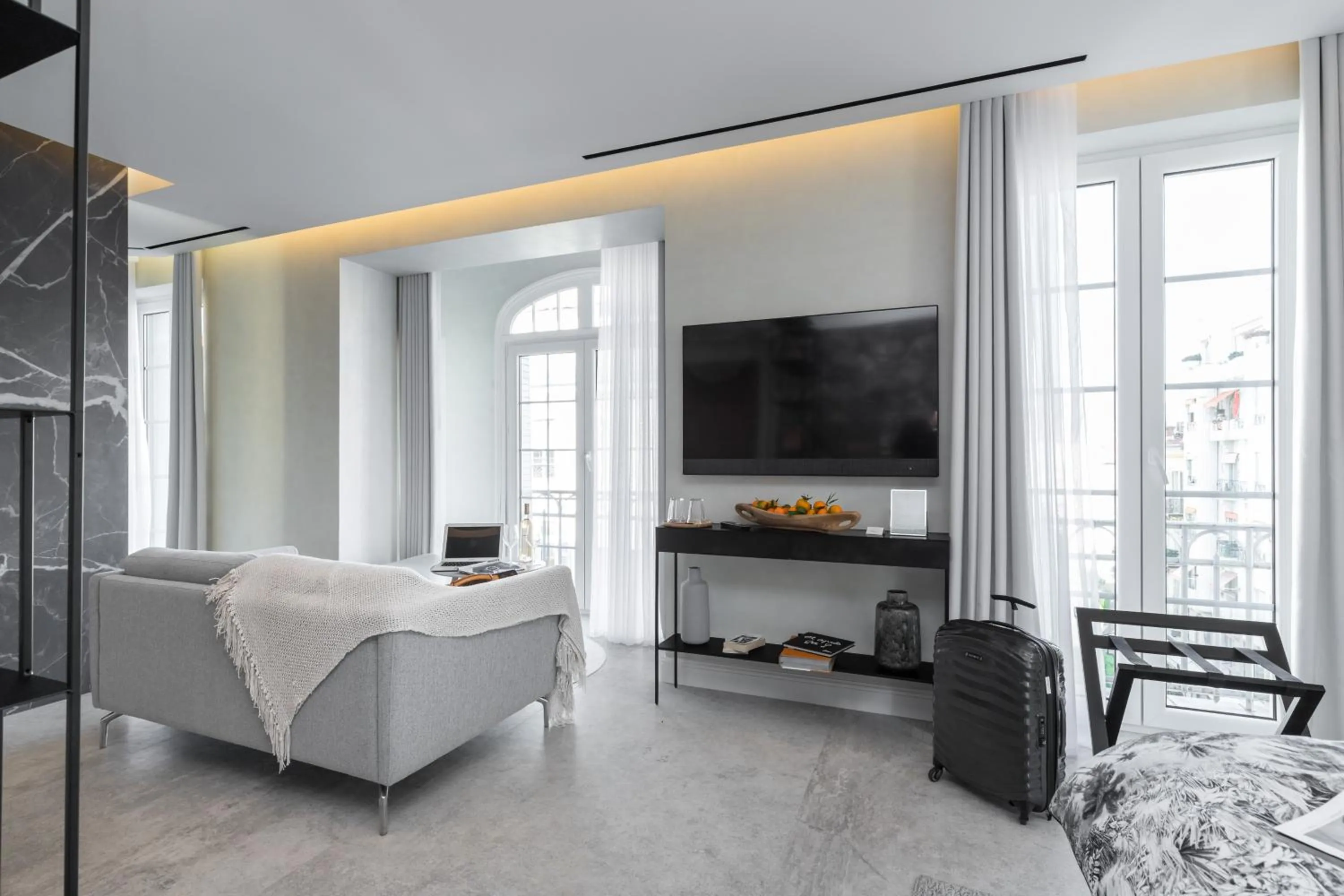 Living room, Bed in Le Dortoir Boutique Suites