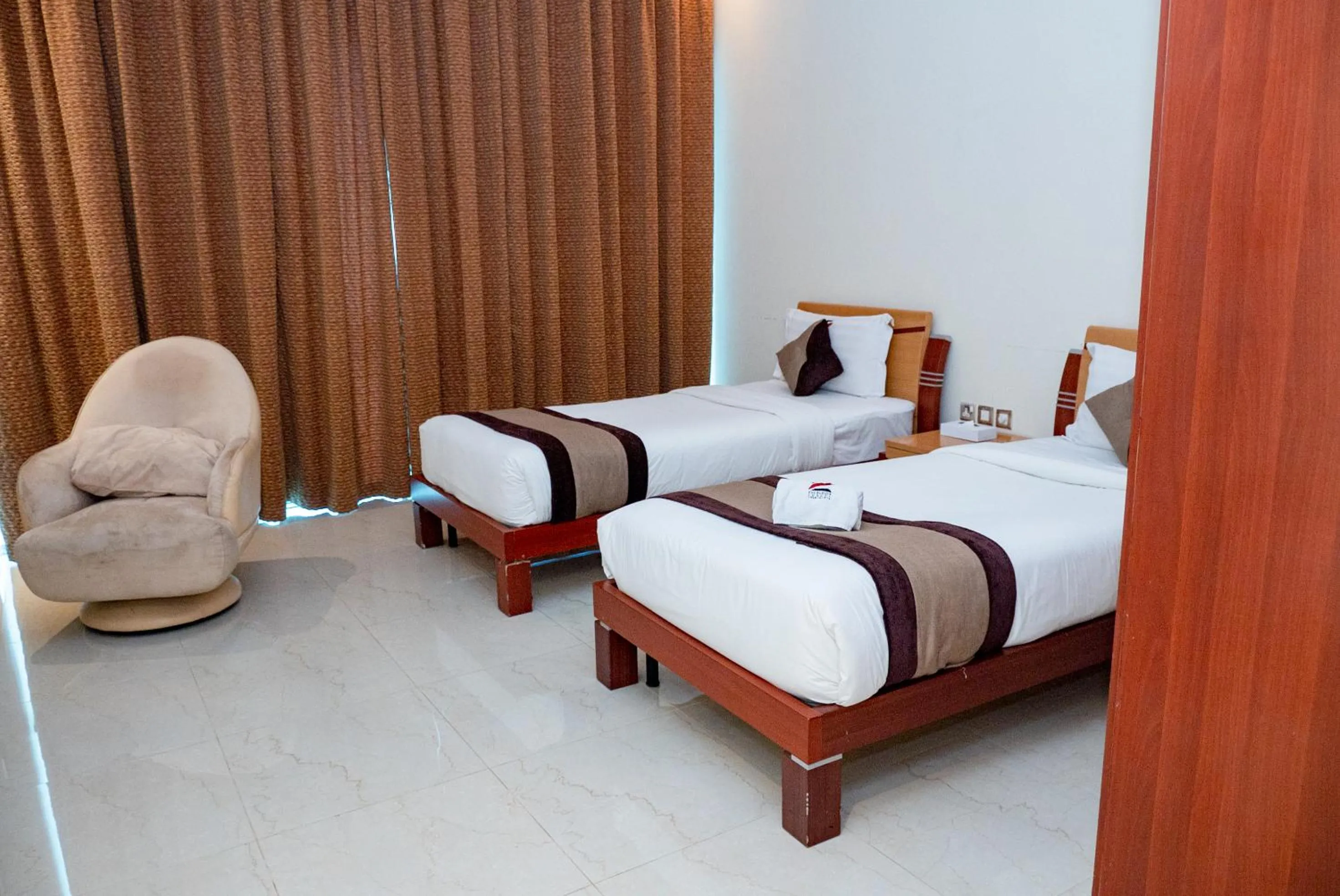 Bed in Excelsior Luxury Apartments